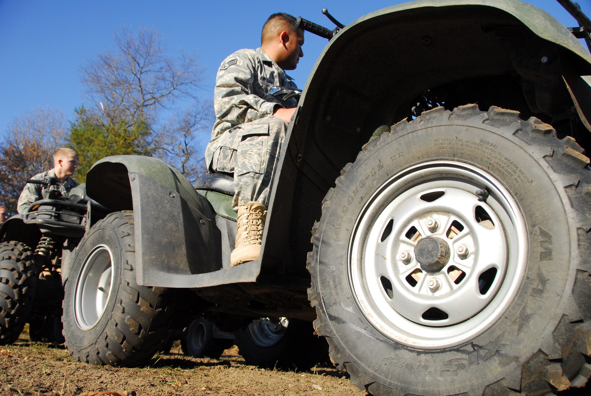 Senior Airmen Jose Arellano (right), 115th Fighter Wing Security Forces member listens to instruction during an All Terrain Vehicle training course of instruction at Volk Field Combat Readiness Training Center Nov. 1, 2009.  115th SF Airmen attended this training course to learn how to operate an A.T.V in various environments, a requirement for their job. (U.S. Air Force photo by Master Sgt. Dan Richardson)