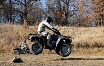 A Member of the115th Fighter Wing Security Forces jumps his All Terrain Vehicle over an obstacle during an A.T.V training course held at Volk Field Combat Readiness Training Center Nov. 1, 2009.  115th SF Airmen attended this training course to learn how to operate an A.T.V in various environments, a requirement for their job. (U.S. Air Force photo by Capt. Suzanne Vanderweyst)