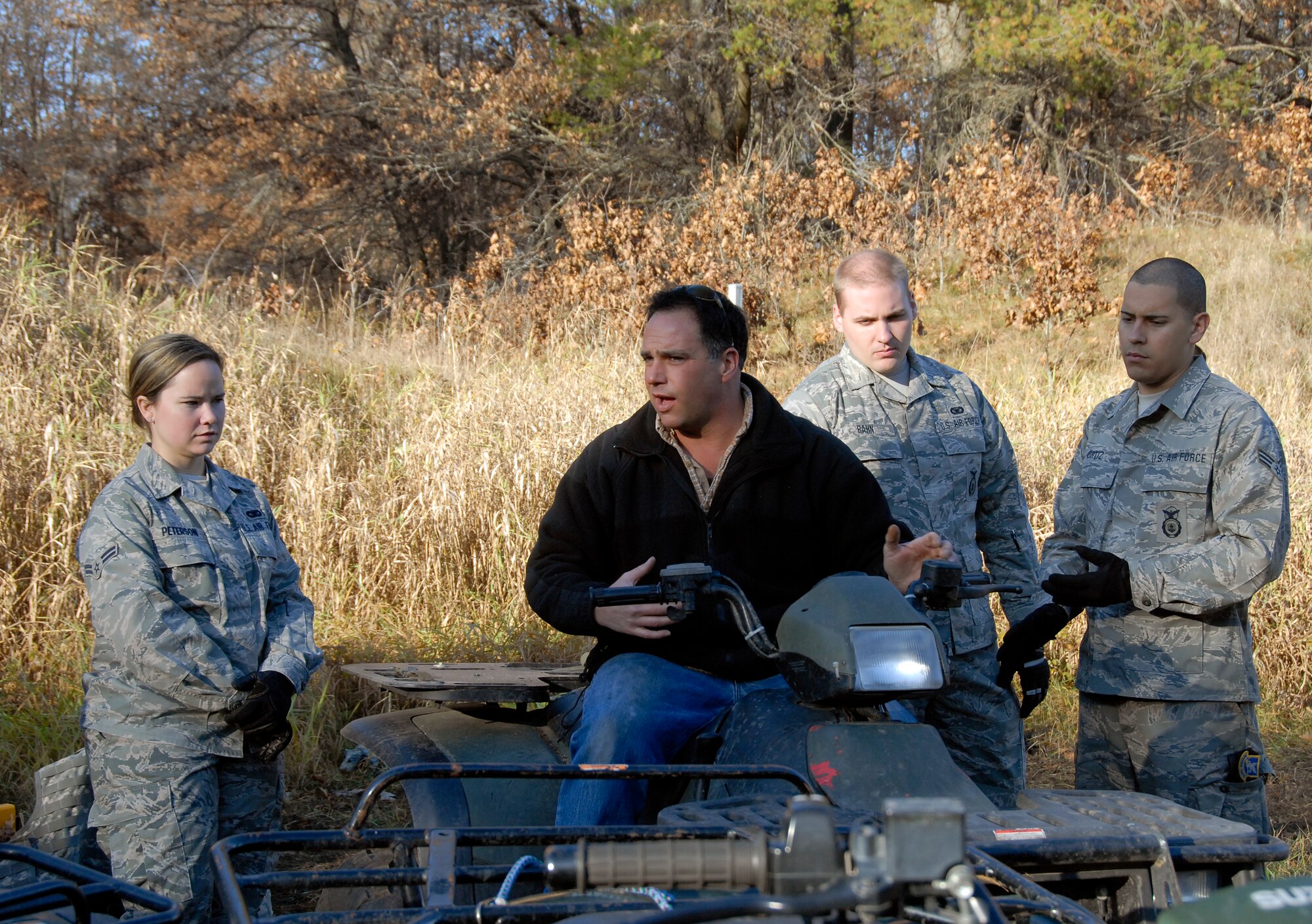 Tech. Sgt. Max Fortin, 115th Fighter Wing Security Forces member and certified All Terrain Vehicle Instructor, explains how to operate an A.T.V to fellow 115th SF Airmen at Volk Field Combat Readiness Training Center Nov. 1, 2009.  115th Fighter Wing Security Forces members are required to know how to operate an A.T.V in various environments. (U.S. Air Force photo by Capt. Suzanne Vanderweyst)