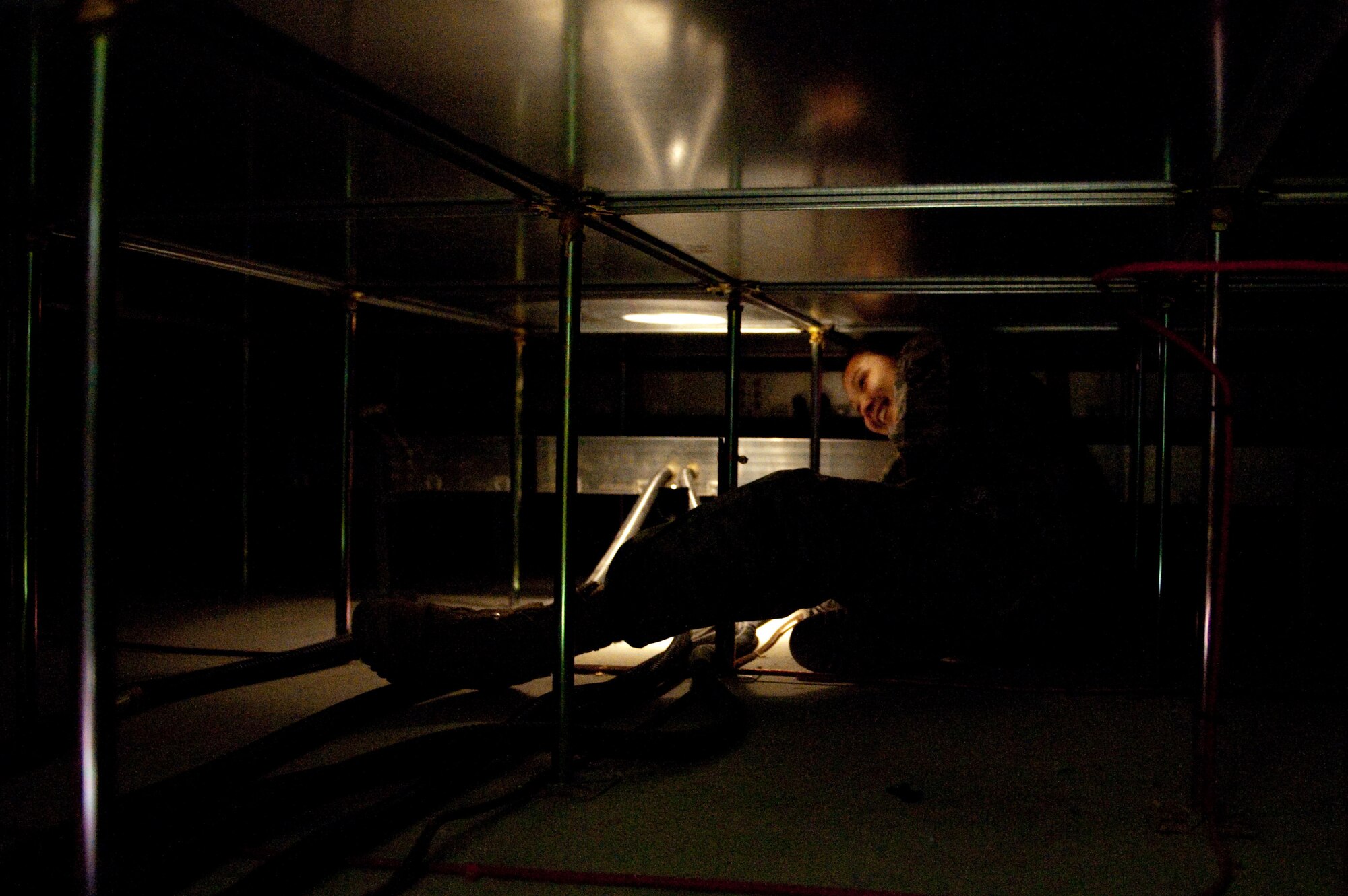 Staff Sgt. Grace Spoerle, 379th Expeditionary Communications Squadron telephone systems repair craftsman, determines which Category 5 cable requires repair, Nov. 27, in Southwest Asia. Sergeant Spoerle helps to keep telephones, computers and other communication systems operating correctly. (U.S. Air Force photo/Staff Sgt. Robert Barney) 