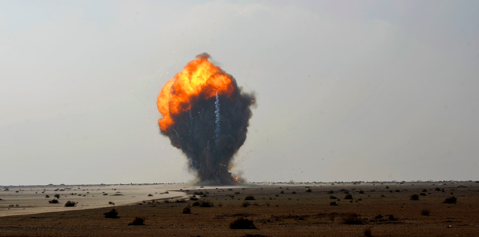 Over a thousand pounds of explosive ordnance explodes in a controlled detonation performed by Iraqi and U.S. Air Force Explosive Ordnance Disposal technicians in Mahmudiyah, Iraq, Nov. 23, 2009. The U.S. Air Force Airmen are assigned to the 447th Expeditionary Civil Engineer Squadron. (U.S. Air Force photo/Staff Sgt. Angelita Lawrence)
