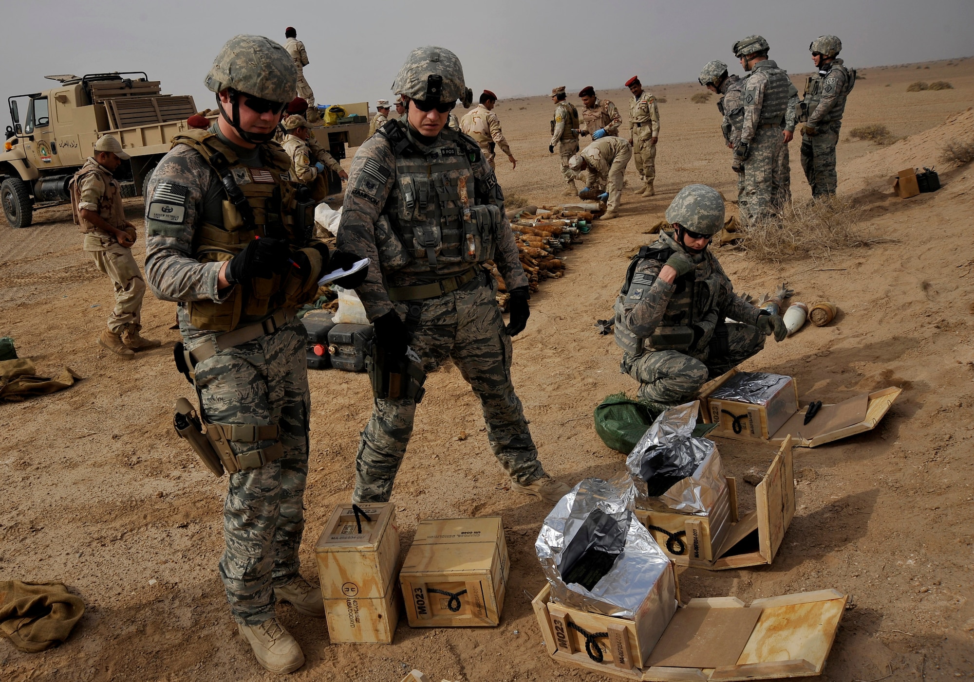 U.S. Air Force explosive ordnance disposal technicians from the 447th Expeditionary Civil Engineer Squadron, deployed to Mahmudiyah, Iraq, prepare for a controlled detonation by taking inventory of the number of boxes of C-4 they have available, Nov. 23, 2009. The purpose of the control detonation is to mitigate explosives hazards and limit the enemy's warfighting capabilities in Iraq. (U.S. Air Force photo/Staff Sgt. Angelita Lawrence)