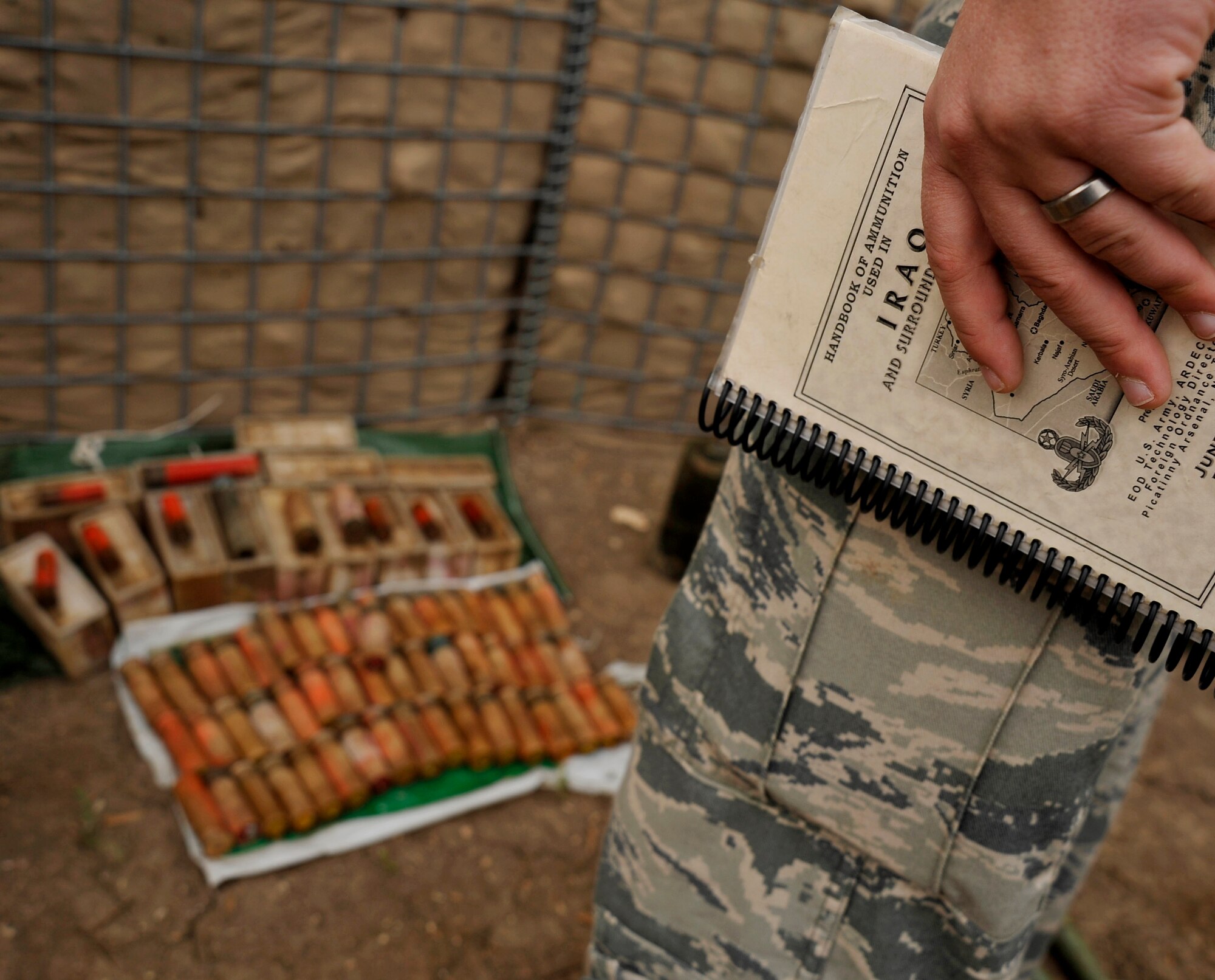 U.S. Air Force Staff Sgt. Cody Flood, 447th Expeditionary Civil Engineer Squadron explosive ordnance disposal technician, deployed to Mahmudiyah, Iraq, collects data on the number of explosives to prepare for a controlled detonation, Nov. 23, 2009. (U.S. Air Force photo/Staff Sgt. Angelita Lawrence)

