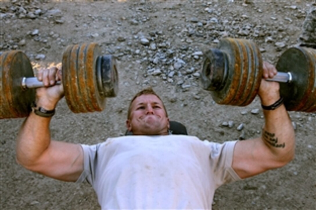 U.S. Army Sgt. Bryan Heinz lifts weights on Combat Outpost Cherkatah, Khowst province, Afghanistan, Nov. 26, 2009. Heinz is deployed with Company D, 3rd Battalion, 509th Infantry Regiment. 