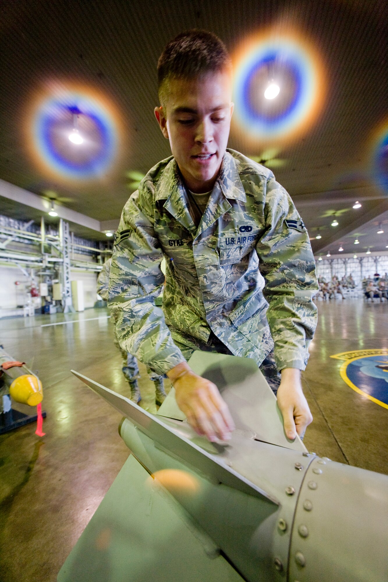 MISAWA AIR BASE, Japan -- Airman 1st Class Andrew Gyke, 13th Aircraft Maintenance Unit load-crew member, prepares a GBU-31 joint direct attack munition during a weapons-load crew of the year competition Nov. 25 at Hangar 911. The competition also consisted of a written exam and tool-box inspection. In addition, the members were inspected on their dress and appearance. Airman Gyke's team won the competition with a score of 1,825 and a load time of 14:35. (U.S. Air Force photo/Senior Airman Jamal D. Sutter)