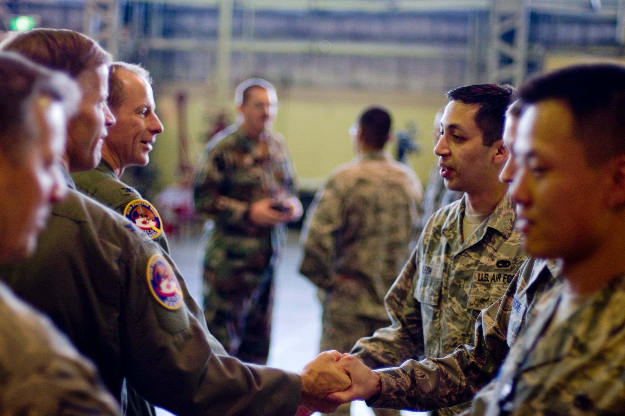 MISAWA AIR BASE, Japan -- After the load crews completed the weapons-load crew of the year competition, 35th Fighter Wing leadership congratulates Airmen, to included members of the 14th Aircraft Maintenance Unit, Nov. 25 at Hangar 911. The load crews showcased the wing's weapon capabilities, while putting on a show for dozens of co-workers and guests. (U.S. Air Force photo/Senior Airman Jamal D. Sutter)
