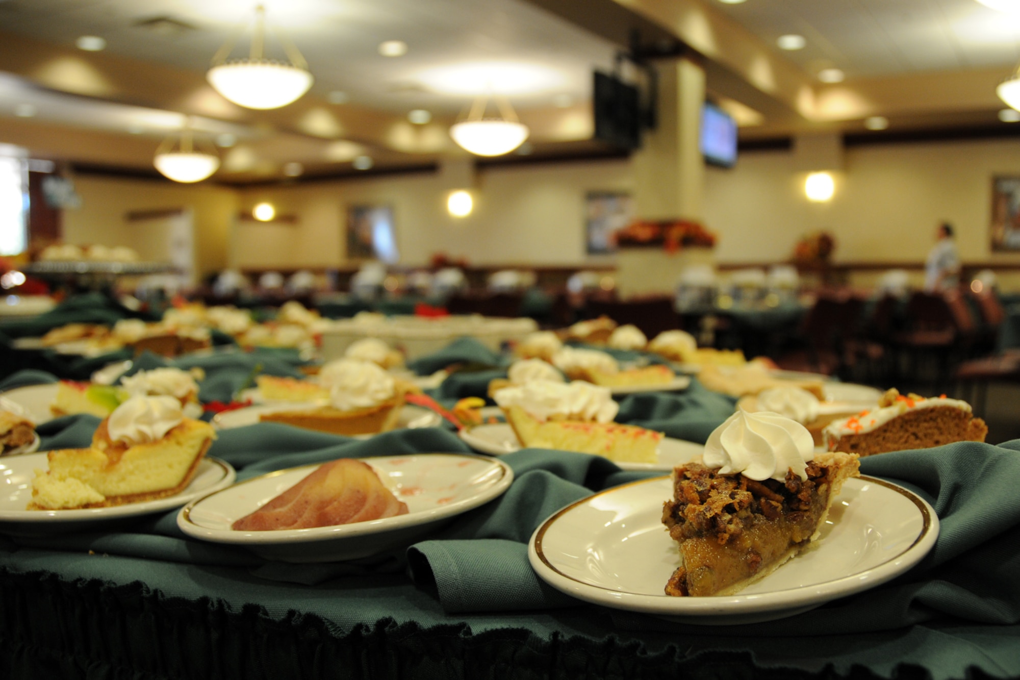 EGLIN AIR FORCE BASE, Fla. –  Plates of dessert sit in the dining area of the Eglin Breeze Dining Facility, Nov. 26. Turkey, roast beef and all the trimmings were available to Eglin Warriors, dependants, visiting family members and retirees for Thanksgiving. Col. Bruce McClintock, 96th Air Base Wing commander was joined by Maj. Gen. Charles Davis, Air Armament Center commander and program executive officer for weapons, and other senior base leadership serving food to customers. The facility prepared food in anticipation for about 550 guests. (U.S. Air Force photo/Airman 1st Class Anthony Jennings)