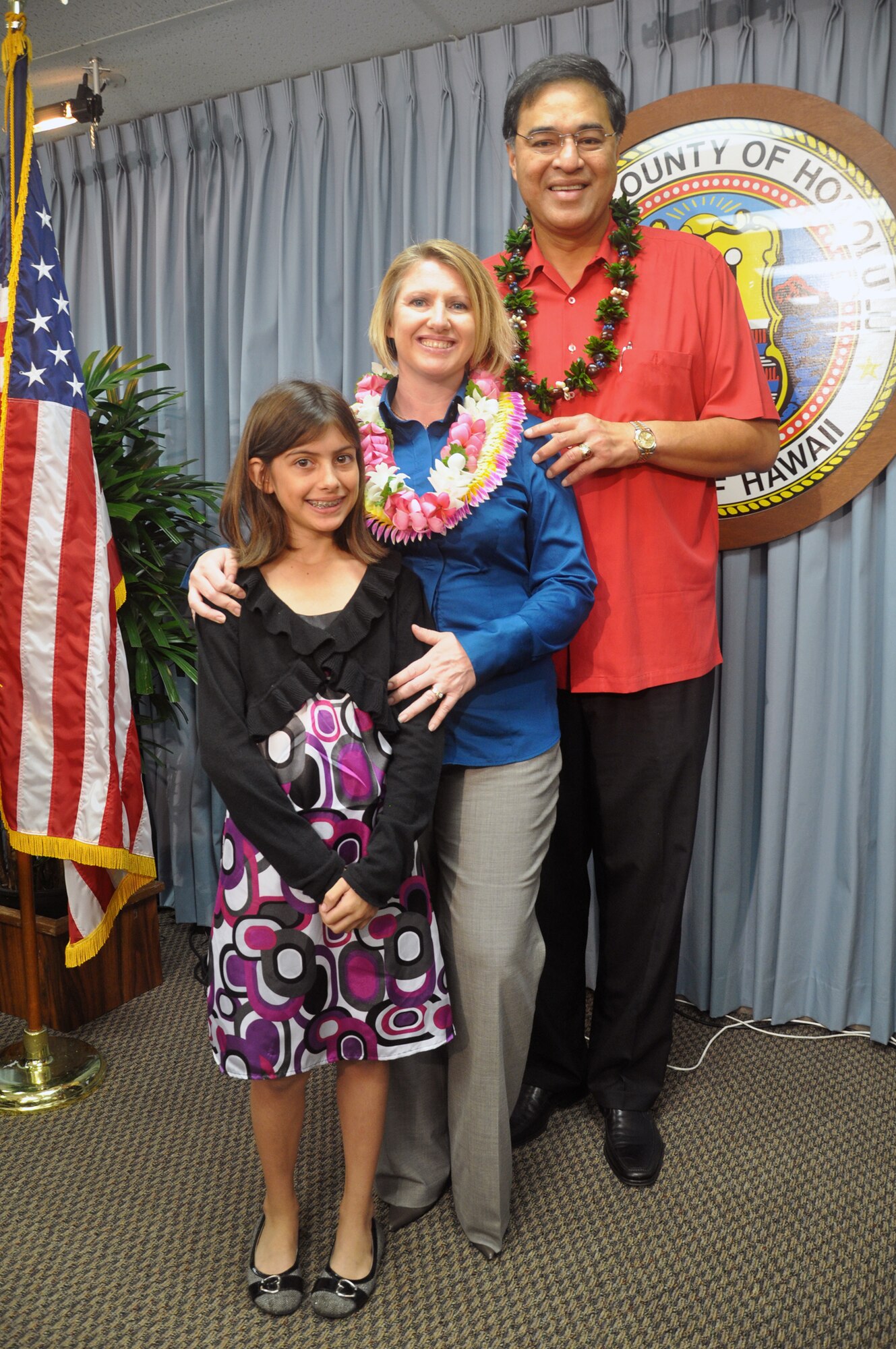 HICKAM AIR FORCE BASE, Hawaii -- Oahu’s mayor, Mufi Hannemann, recognized Key Spouse Sharron Ortiz on behalf of The Navy League and Hickam leadership Nov. 27 in Honolulu. Mrs. Ortiz is the only Key Spouse for 182 deployed Airmen in the 15th Security Forces Squadron, 88 of whom are first-term Airmen with 21 spouses under the age of 20. She was presented with a $1,000 check and letters from the Secretary of Defense and Mayor Hannemann. Her 11-year-old daughter, Hallie, also attended. (U.S. Air Force photo by Staff Sgt. Carolyn Viss)