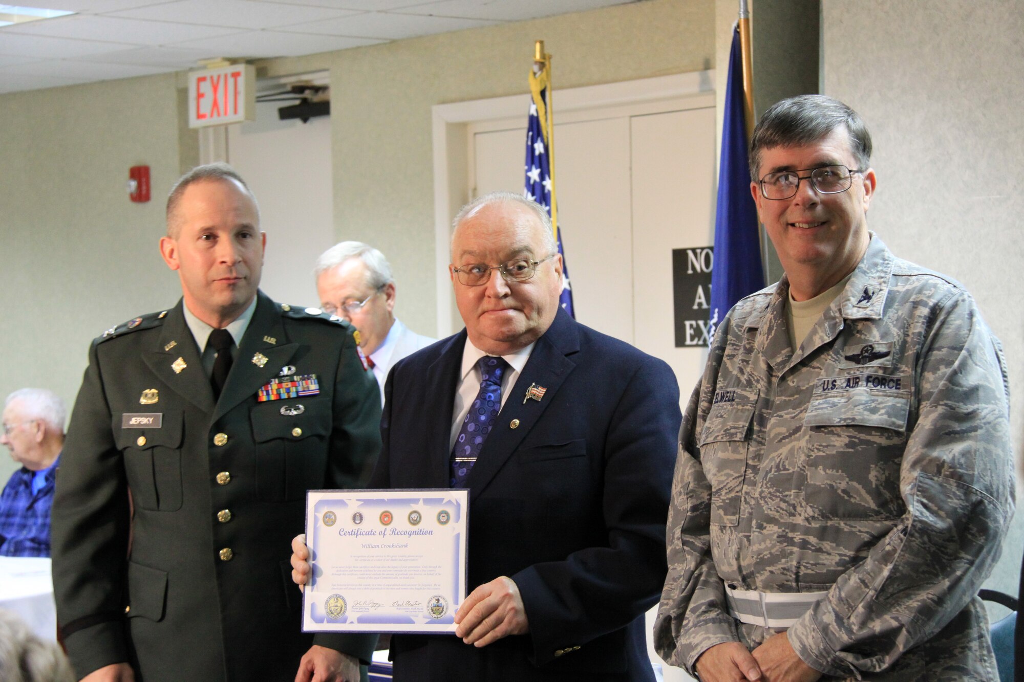 U.S. Army Veteran, William Crookshank (center) received a certificate of recognition for his participation in the Korean War, from Col. Arthur Jepsky, 316th Expeditionary Sustainment Command commander (left)and Col. Gordon H. Elwell, Jr., 911th Airlift Wing commander (right). The event, sponsored by Pa. State Representative Mark Mustio and Pa. State Senator John Pippy recognized 31 Korean War Veterans and 32 Vietnam War Veterans from the local area, during a recognition ceremony held here, Nov. 13, 2009.   