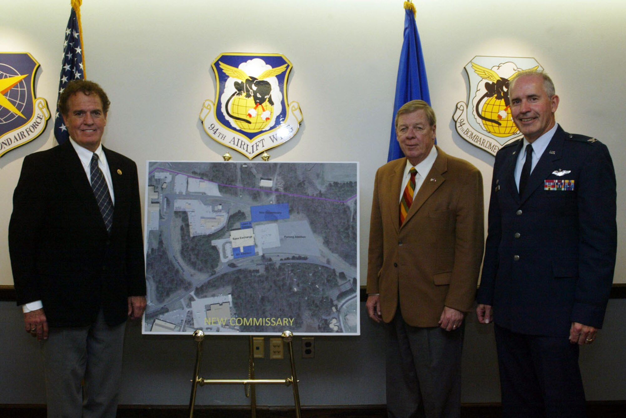Rep. Phil Gingrey of Marietta, Ga., Sen. Johnny Isakson (Ga.) and Col. Steven Slick, 94th Mission Support Group commander, pose with a site plan for a new commissary  at Dobbins Air Reserve Base Nov. 23. The commissary will replace those closing at Fort McPherson and Fort Gillem due to the Army installations closing in 2011. The new Dobbins commissary will provide an outlet for military personnel and their families to buy affordable goods in the Metro Atlanta area. (U.S. Air Force photo/Don Peek)
