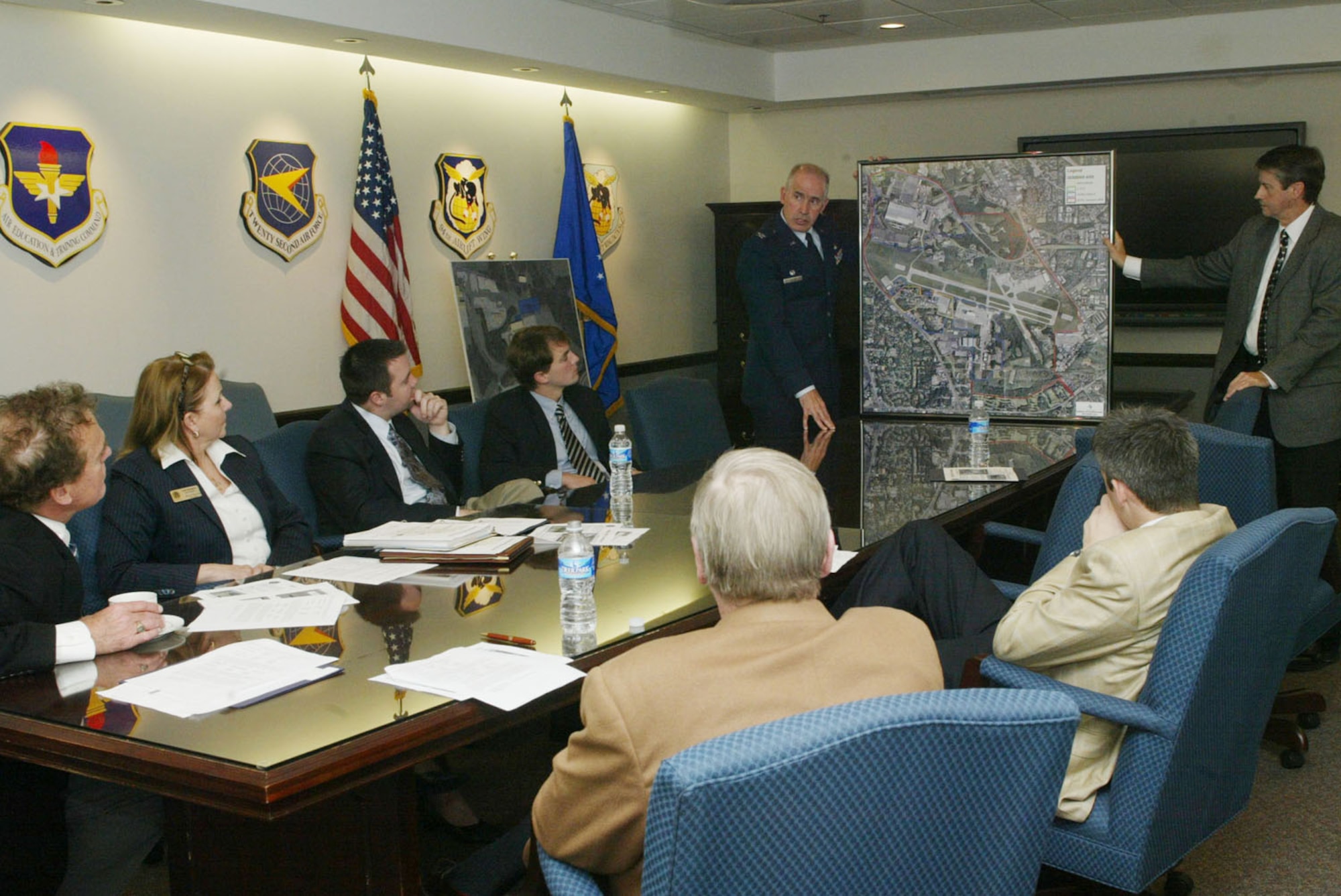Col. Steven Slick, 94th Mission Support Group commander, and Ken Williams, 94th Civil Engineer director, briefs Sen. Johnny Isakson (Ga.), Rep. Phil Gingrey of Marietta, Ga., and their staffers Nov. 23 on plans for building a new commissary on Dobbins Air Reserve Base. The commissary will replace those closing at Fort McPherson and Fort Gillem due to the Army installations closing in 2011. The new Dobbins commissary will provide an outlet for military personnel and their families to buy affordable goods in the Metro Atlanta area. (U.S. Air Force photo/Don Peek)