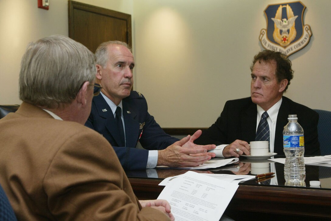 Col. Steven Slick, 94th Mission Support Group commander, briefs Sen. Johnny Isakson (Ga.), left, and Rep. Phil Gingrey, right, of Marietta, Ga., Nov. 23 on plans for building a new commissary on Dobbins Air Reserve Base. The commissary will replace those closing at Fort McPherson and Fort Gillem due to the Army installations closing in 2011. The new Dobbins commissary will provide an outlet for military personnel and their families to buy affordable goods in the Metro Atlanta area. (U.S. Air Force photo/Don Peek)