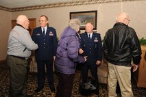 MINOT AIR FORCE BASE, N.D. -- Col. Douglas Cox, 5th Bomb Wing commander, and Col. Ferdinand Stoss, 91st Missile Wing commander, greet senior citizens from Minot and the surrounding communities to a free Thanksgiving meal during the base’s annual “Day of Love” celebration here Nov. 26. The base has hosted the Day of Love since 1969, and its popularity with the base and local community has made it a long-standing tradition ever since. (U.S. Air Force photo by Airman 1st Class Jesse Lopez)
