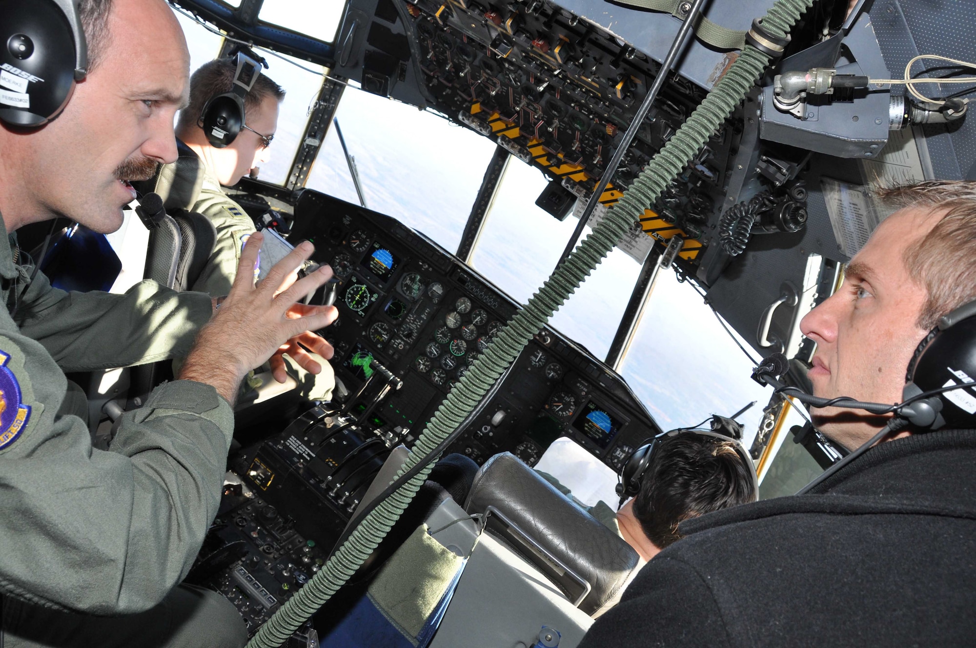 Master Sgt. Shannon Moerke (left) 96th Airlift Squadron flight engineer, talks with Pastor Jeffrey Mittelstadt during the 934th Airlift Wing?s Clergy Day orientation flight Oct. 27. The annual event allows clergy members to fly aboard a C-130 to learn about the 934th Airlift Wing and the Air Force Reserve. (Air Force Photo/Master Sgt. Paul Zadach).