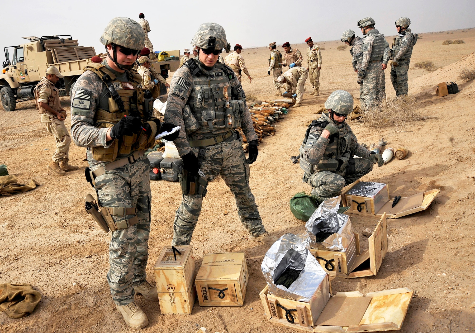 Air Force explosive ordnance disposal technicians prepare for a controlled detonation by taking inventory of the number of boxes of C-4 they have available, Nov. 23, 2009, at Mahmudiyah, Iraq. The purpose of the control detonation is to mitigate explosives hazards and limit the enemy's warfighting capabilities in Iraq. The EOD Airmen are from the 447th Expeditionary Civil Engineer Squadron, deployed to Mahmudiyah, Iraq. (U.S. Air Force photo/Staff Sgt. Angelita Lawrence)