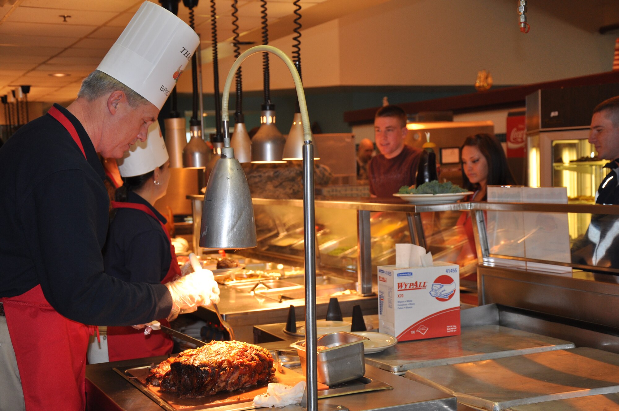 Brig. Gen. O.G. Mannon, 82nd Training Wing commander, serves Thanksgiving meals to the Sheppard Airmen Nov. 26. Several officers and senior enlisted members manned the food stations at the Tumbleweed Dining Facility in this year’s event. (U.S. Air Force Photo/ Airman 1st Class Adawn Kelsey)