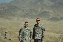 SEYMOUR JOHNSON AIR FORCE BASE, N.C. --  Chief Master Sergeant David Jackson (right) and Army Sgt. 1st Class Juan Patino stand on top of a mountain near an Afghan lookout post.  Chief Jackson is currently stationed at Camp Eggers, Kabul, Afghanistan where he serves as superintendent of the Logistic Directorate.  At home, the chief serves as a Reservist with the 916th Aircraft Maintenance Squadron. (courtesy photo)                   