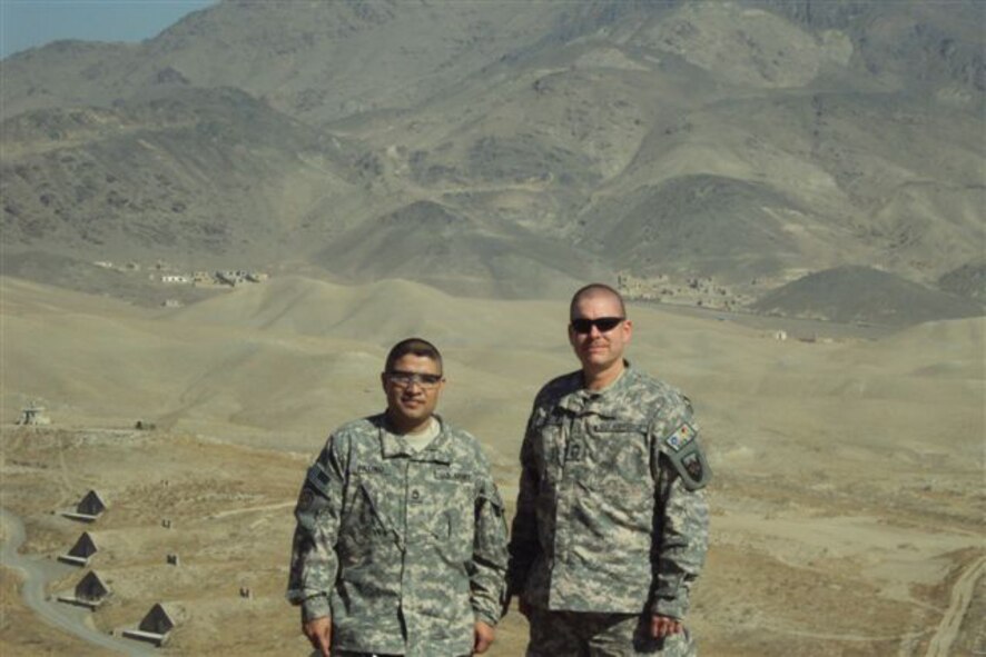 SEYMOUR JOHNSON AIR FORCE BASE, N.C. --  Chief Master Sergeant David Jackson (right) and Army Sgt. 1st Class Juan Patino stand on top of a mountain near an Afghan lookout post.  Chief Jackson is currently stationed at Camp Eggers, Kabul, Afghanistan where he serves as superintendent of the Logistic Directorate.  At home, the chief serves as a Reservist with the 916th Aircraft Maintenance Squadron. (courtesy photo)                   
