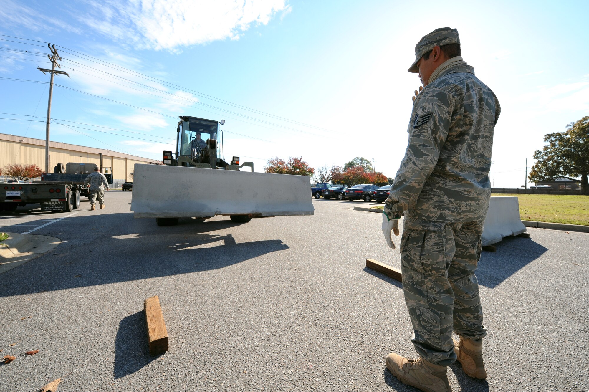 SHAW AIR FORCE BASE, S.C. -- Airmen of the 20th Civil Engineering Squadron place barriers to protect certain facilities as part of a 'module plan' during Shaw's Phase I exercise Nov. 30. (U.S. Air Force Photo/Tech. Sgt. Louis Rivers)
