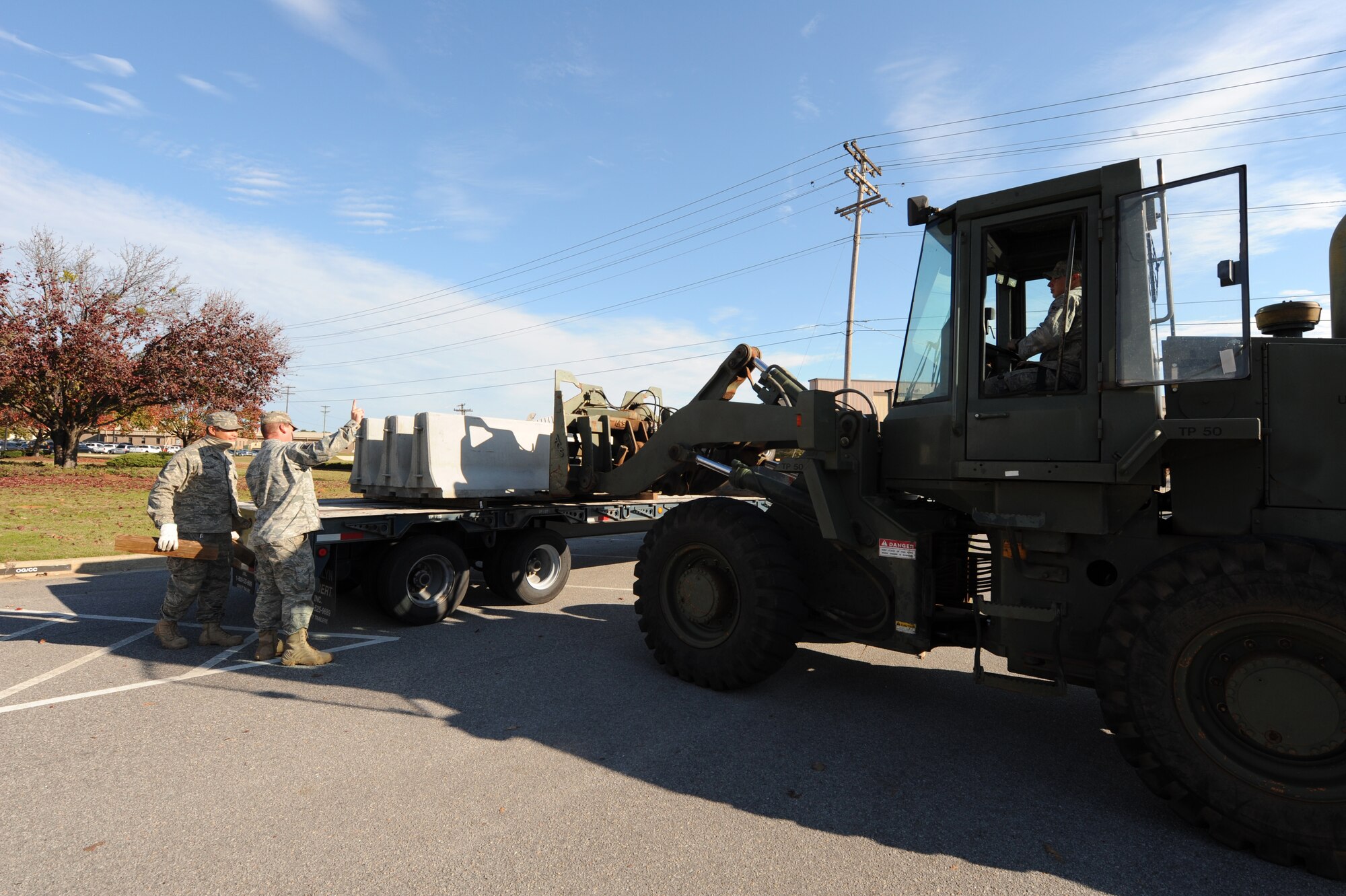 SHAW AIR FORCE BASE, S.C. -- Airmen of the 20th Civil Engineering Squadron place barriers to protect certain facilities as part of a 'module plan' during Shaw's Phase I exercise Nov. 30. (U.S. Air Force photo/Tech. Sgt. Louis Rivers)