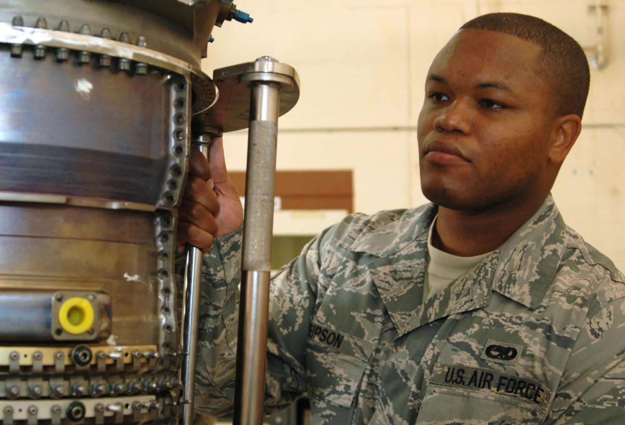 Senior Airman Raymond Gipson, jet engine mechanic from the 917th Maintenance Squadron on Barksdale Air Force Base, La., performs routine maintenance on an engine during his unit training assembly weekend (UTA). Airman Gipson, who is originally from Monroe, La., has been in the Air Force for six years and enjoys bowling with friends. Airman Gipson says he wanted to be the first person in his family to join the military, and is glad he did because of the amazing benefits in the Air Force Reserve. Airman Gipson recognizes Chief Master Sgt. Combs as the person who has most influenced him in his military career, because he is an excellent role model. Airman Gipson also says that his favorite thing about his job is the people he works with. (U.S. Air Force photo/Airman 1st Class Crystal Jordan)
