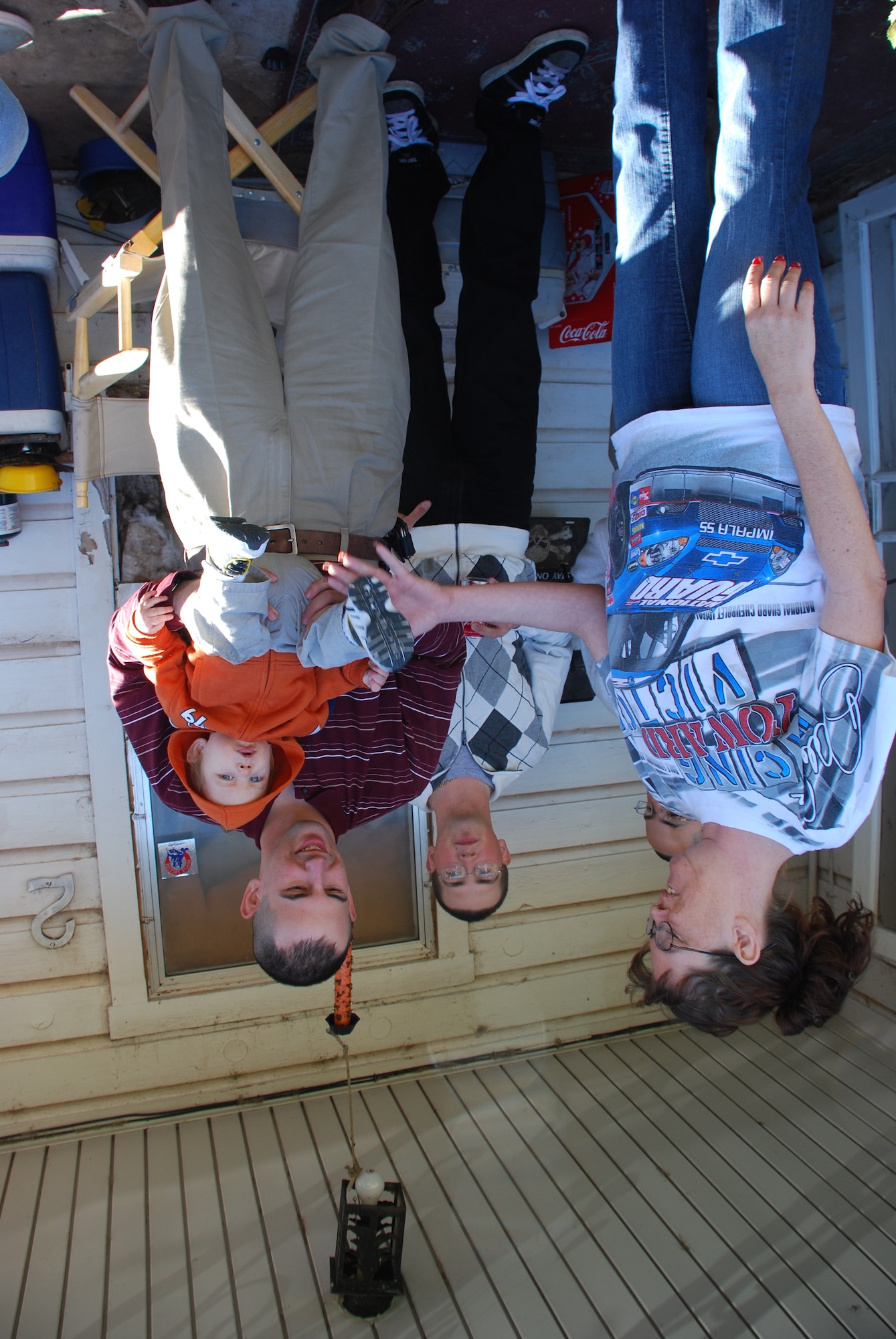 Airman 1st Class Jeff Brice (right), 361st Training Squadron, holds 10 month-old  Zachary Watts, while talking with Loretta Mullin (left), an Operation Thanksgiving host, and Airman Alvis Steven, 364th TRS. (U.S. Air Force photo/ Airman 1st Class Valerie Hosea)