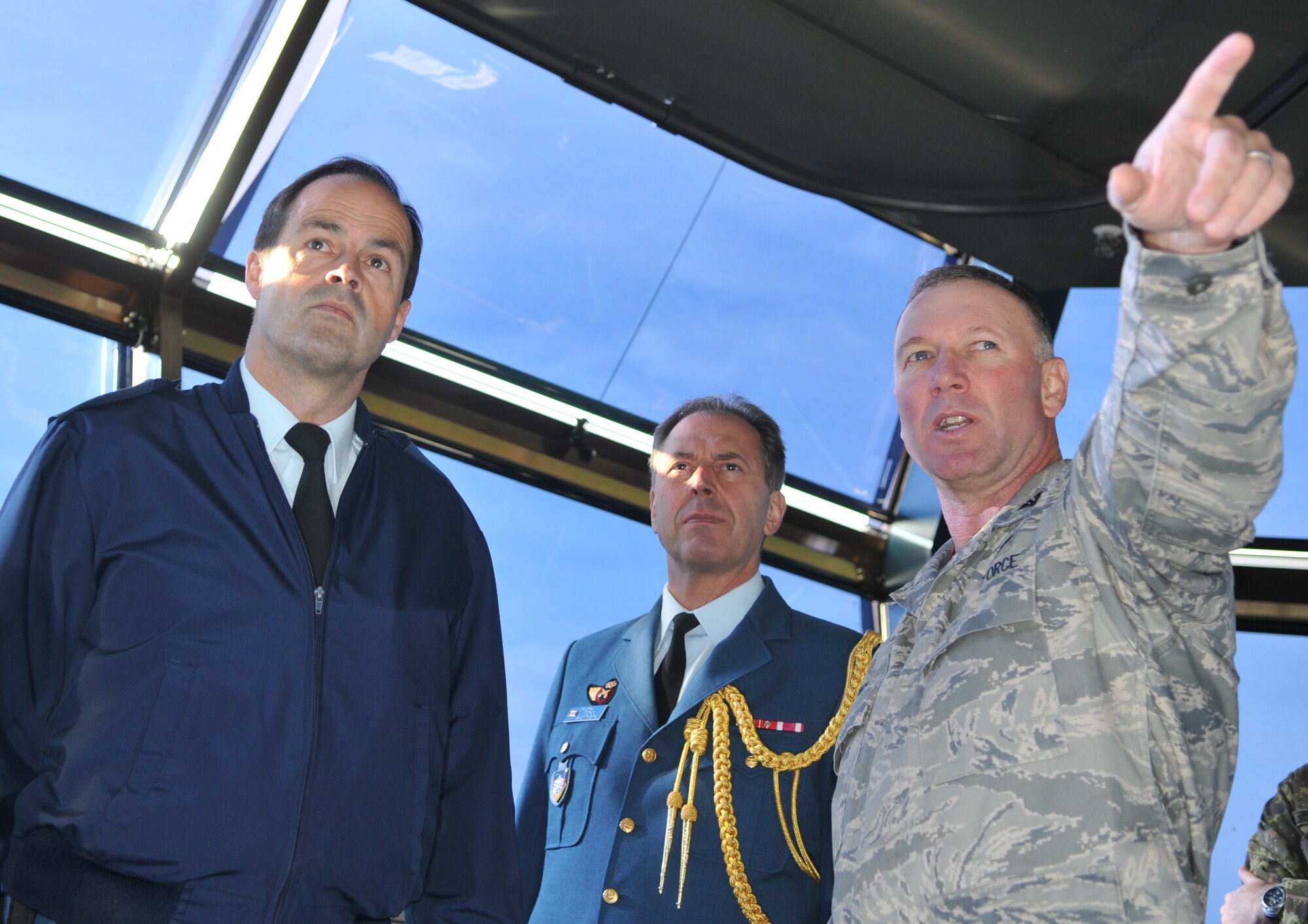 SPANGDAHLEM AIR BASE, Germany -- Col. Tip Wight, 52nd Fighter Wing commander, gives a tour of the air traffic control tower Nov. 25 to Maj. Gen. Tom Lawson, assistant chief of the Canadian Air Staff (left), and Canadian Col. Tony Battista, Canadian Defense Attaché. General Lawson and Colonel Battista came here to visit the Canadian detachment, a transit center for Canadian Forces. (U.S. Air Force photo/Airman 1st Class Nick Wilson)