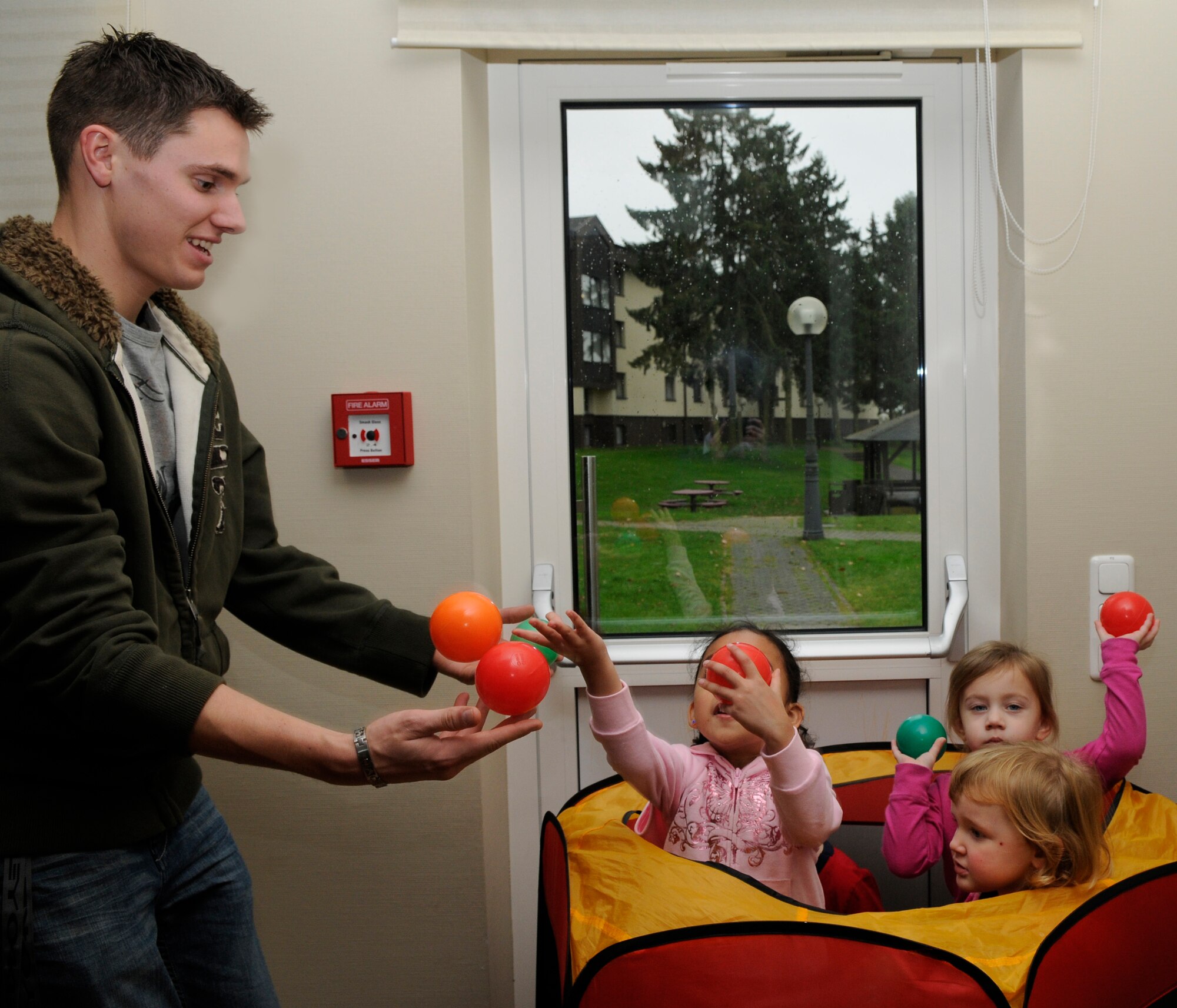 SPANGDAHLEM AIR BASE, Germany – Airman Sean Conaway, 52nd Civil Engineer Squadron Spangdahlem First Four member, provides free child care during the biannual spouses’ call Nov. 23 at the Wilkommen Center. The spouses’ call is an information forum for Saber spouses to share ideas and ask questions about the base. (U.S. Air Force photo/Airman 1st Class Staci Miller)