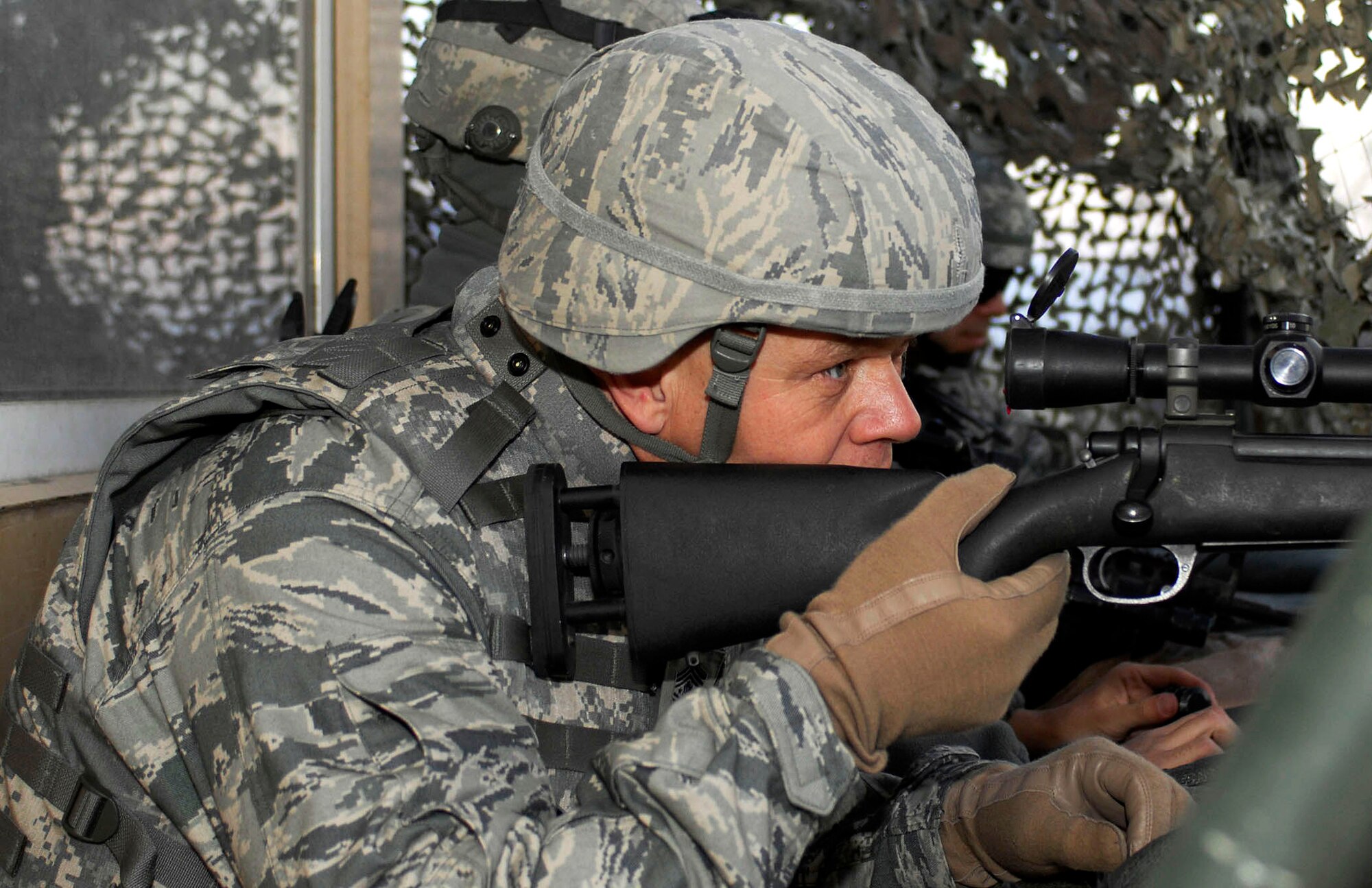 Chief Master Sgt. of the Air Force James A. Roy looks through the scope of an M-24 sniper weapon at one of observation towers Nov. 28, 2009, at Bagram Airfield, Afghanistan. (U.S. Air Force photo/Tech. Sgt. John Jung)