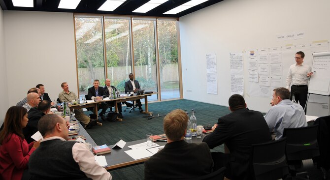 RAF MILDENHALL, England -- Leadership from the 100th Air Refueling Wing defines new vision and mission statements during the 100th ARW Strategy and Deployment conference at The Moller Centre in Cambridge Nov. 19. Four new wing priorities were also established with specific goals to maintain them. (U.S. Air Force photo/Senior Airman Thomas Trower)