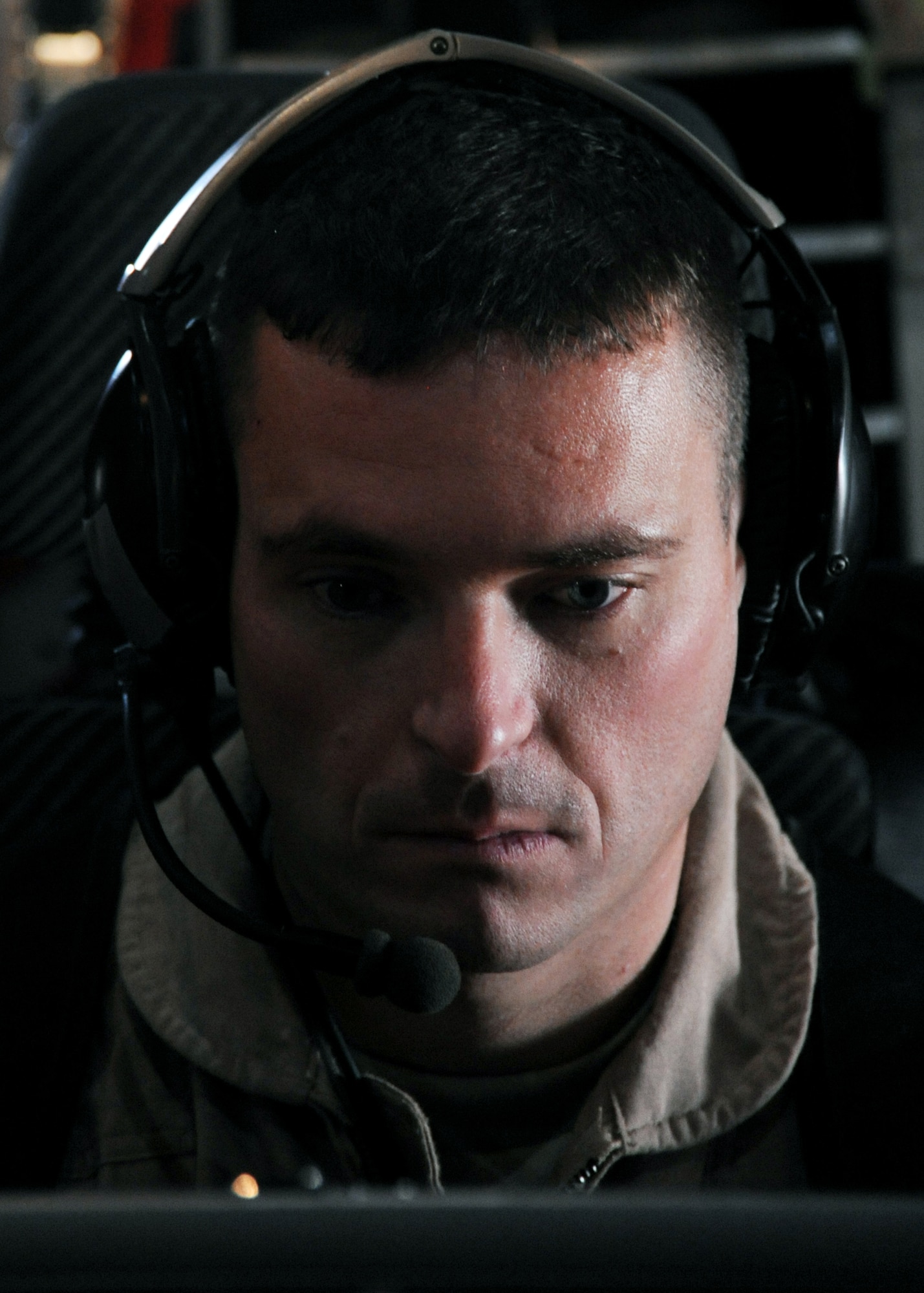 JOINT BASE BALAD, Iraq -- Capt. Jason Davis, 777th Expeditionary Airlift Squadron mission commander, prepares for a joint airborne battle staff detachment mission on a C-130 Hercules Nov. 24, 2009. The JABS is a joint operation focused on providing airborne communications support to ground forces. (U.S. Air Force photo/Senior Airman Christopher Hubenthal)