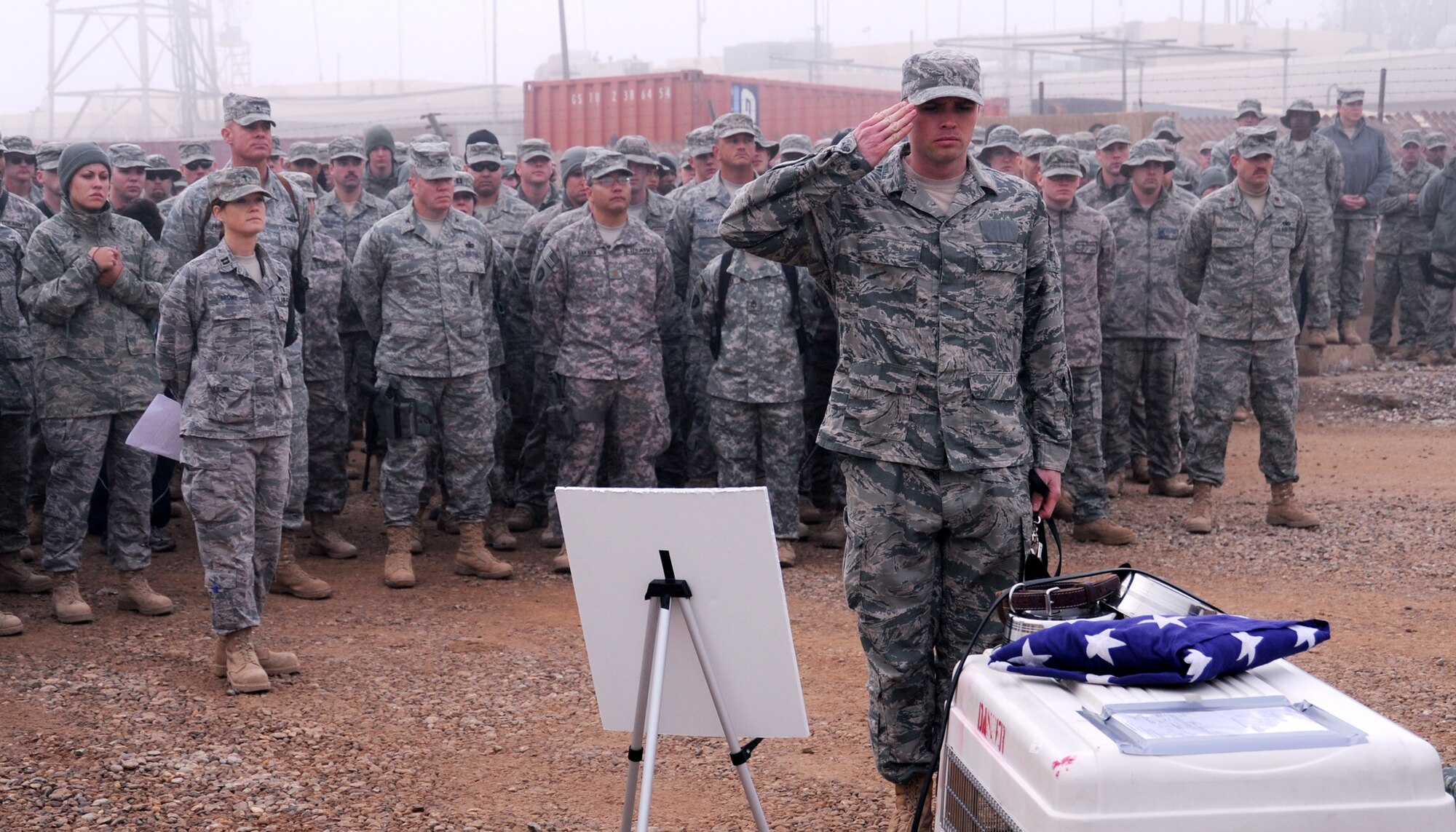 JOINT BASE BALAD, Iraq – Staff Sgt. David Simpson, 332nd Expeditionary Security Forces Group K-9 handler, salutes the kennel of Ikka, a military working dog, at a memorial Nov. 23. Ikka passed away due to natural causes, and the ceremony paid tribute to her military service. Sergeant Simpson is deployed from Spangdahlem Air Base, Germany. (U.S. Air Force photo/Senior Airman Christopher Hubenthal)