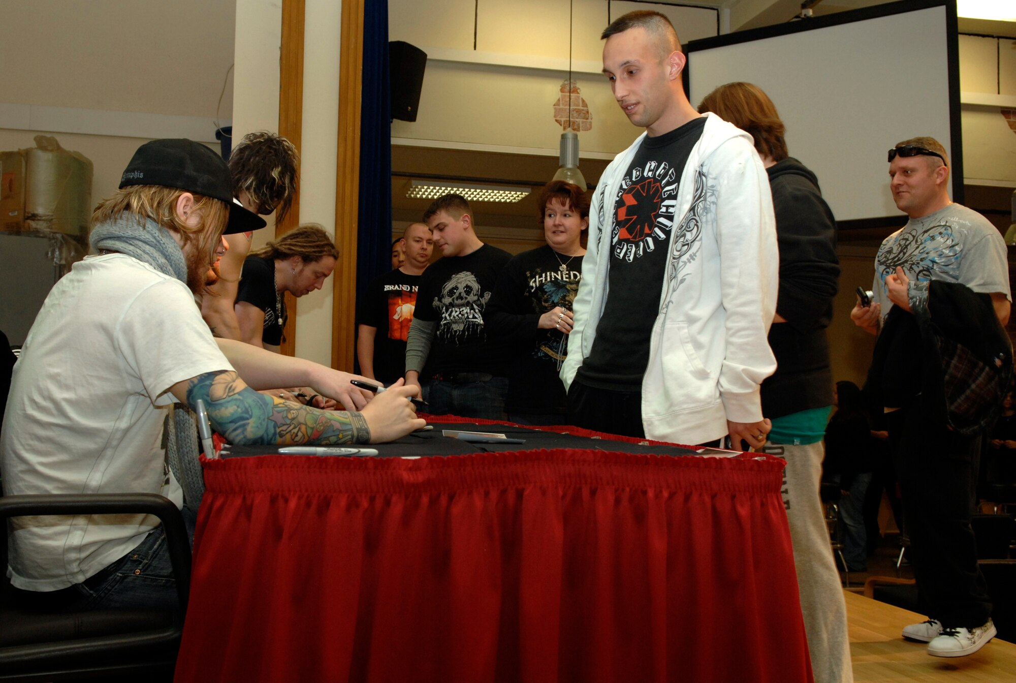 SPANGDAHLEM AIR BASE, Germany – Sabers line the Brick House waiting for autographs and pictures with Shinedown Nov. 20. The band visited Spangdahlem during a European concert tour. (U.S. Air Force photo/Senior Airman Kali L. Gradishar)