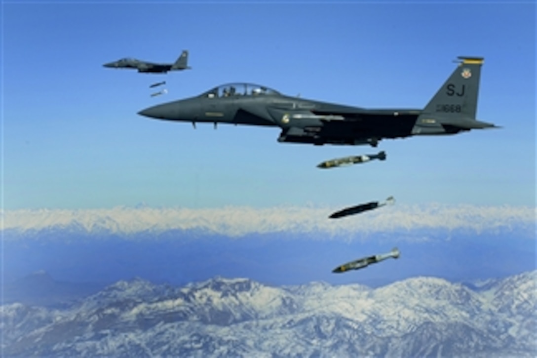 U.S. Air Force F-15E Strike Eagle aircraft from the 335th Fighter Squadron drop 2,000-pound joint direct attack munitions on a cave in eastern Afghanistan on Nov. 26, 2009.  The 335th is deployed to Bagram Airfield, Afghanistan, from Seymour Johnson Air Force Base, N.C.  