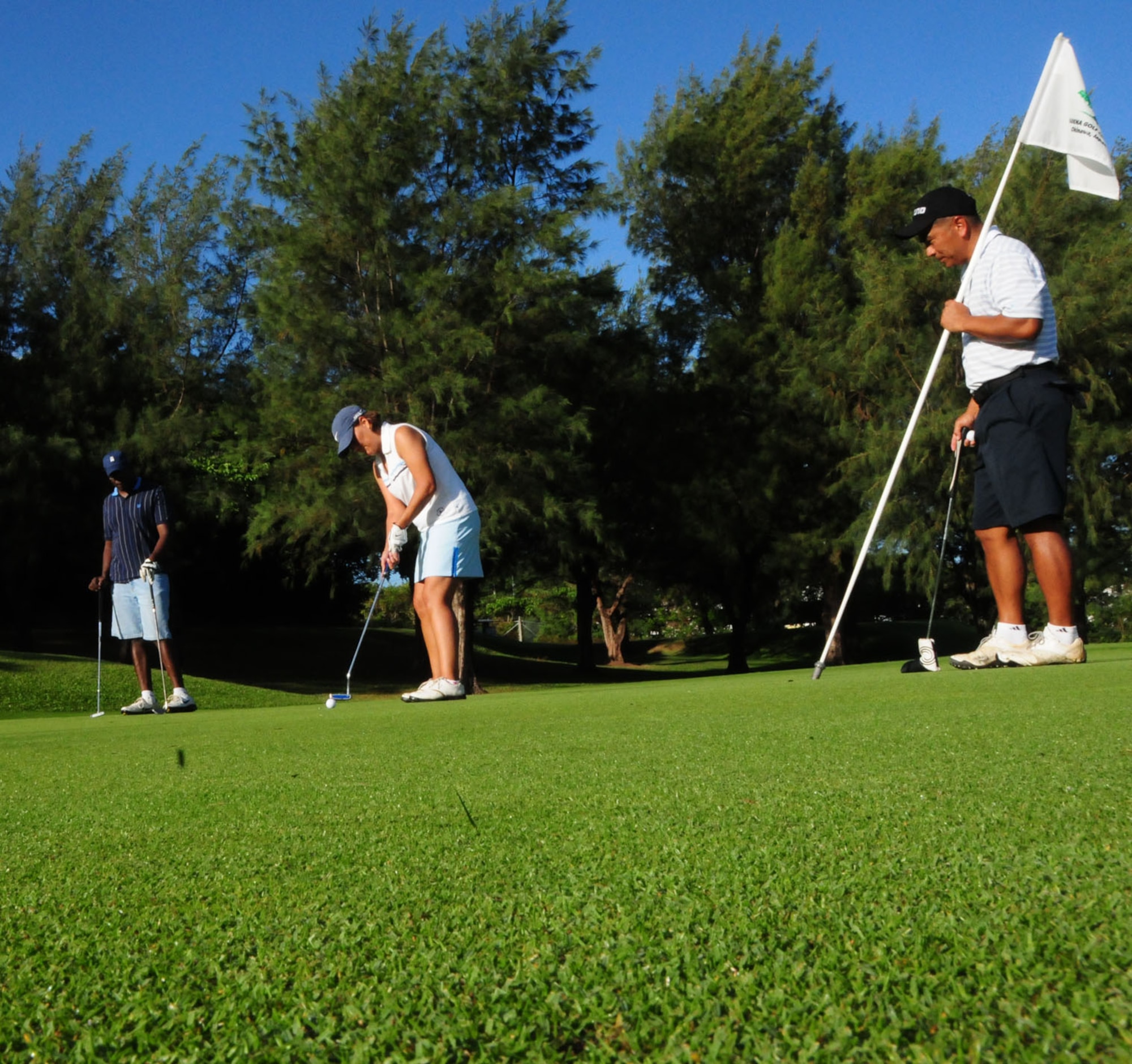 A golfer participating in Kadena's 2009 Combined Federal Campaign Kickoff Golf Tournament tries to sink her putt. The CFC will run through Dec. 5.   
(U.S. Air Force Photo/1st Lt. Joe Kreidel) 