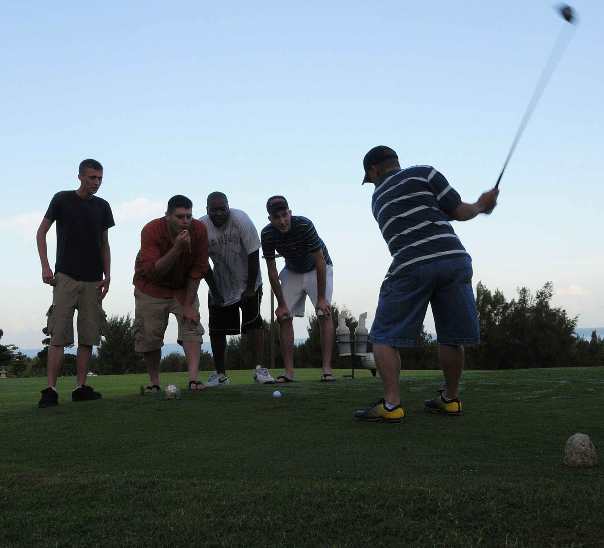 Hecklers try to throw a golfer off his game at the 2009 Combined Federal Campaign Kickoff Golf Tournament. Golfers could donate $2 to the CFC to silence the hecklers. 
(U.S. Air Force Photo/1st Lt. Joe Kreidel) 