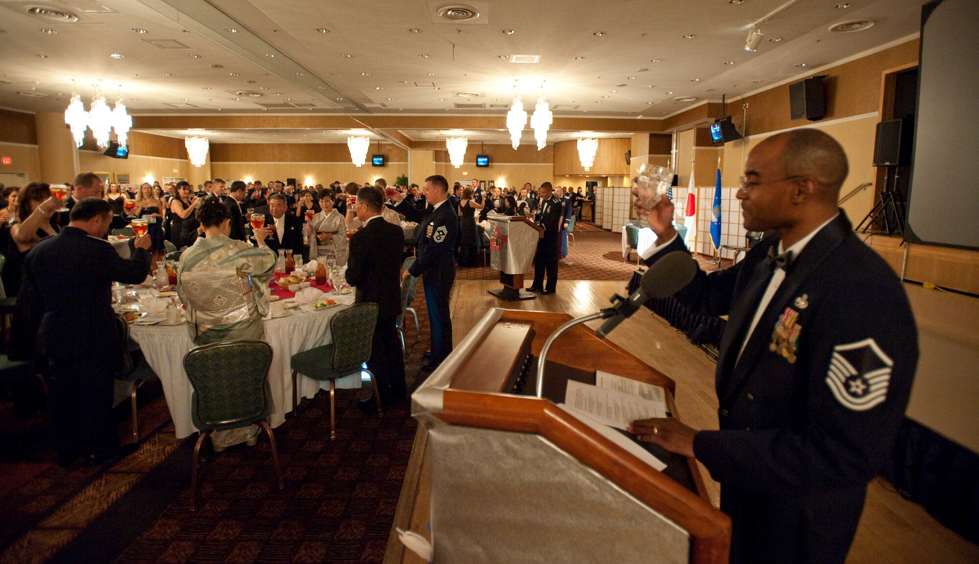 MISAWA AIR BASE, Japan -- Attendees of the 62nd annual Air Force Ball raise a toast to the various leaders of the U.S. and Japanese military in the enlisted club ballroom Sept. 25. The Air Force Ball marked the 62nd birthday of the U.S. Air Force, offers a time for Airmen to reflect on the previous year and look ahead to the next. (U.S. Air Force photo/Staff Sgt. Samuel Morse)
