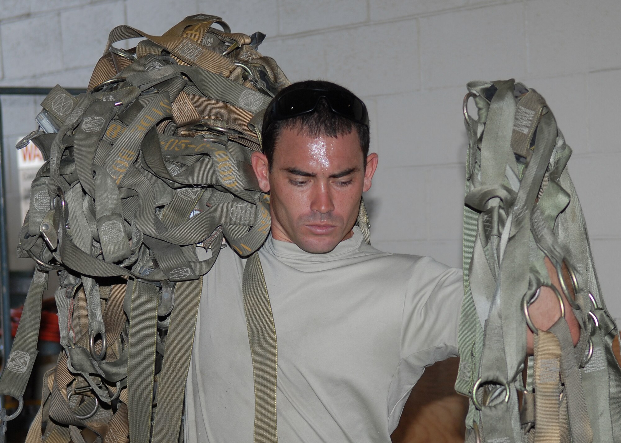 Staff Sgt. Nathan Angel, 15th Logistics Readiness Squadron, prepares cargo nets, in support of a humanitarian mission Sept.30 at Hickam Air Force Base, Hawaii.  Two C-17 Globemaster IIIs carried relief supplies and approximately 100 military personnel to the island of American Samoa, which was affected by an earthquake and Tsunami Sept. 29. (U.S. Air Force photo/Tech. Sgt. Jerome S. Tayborn)