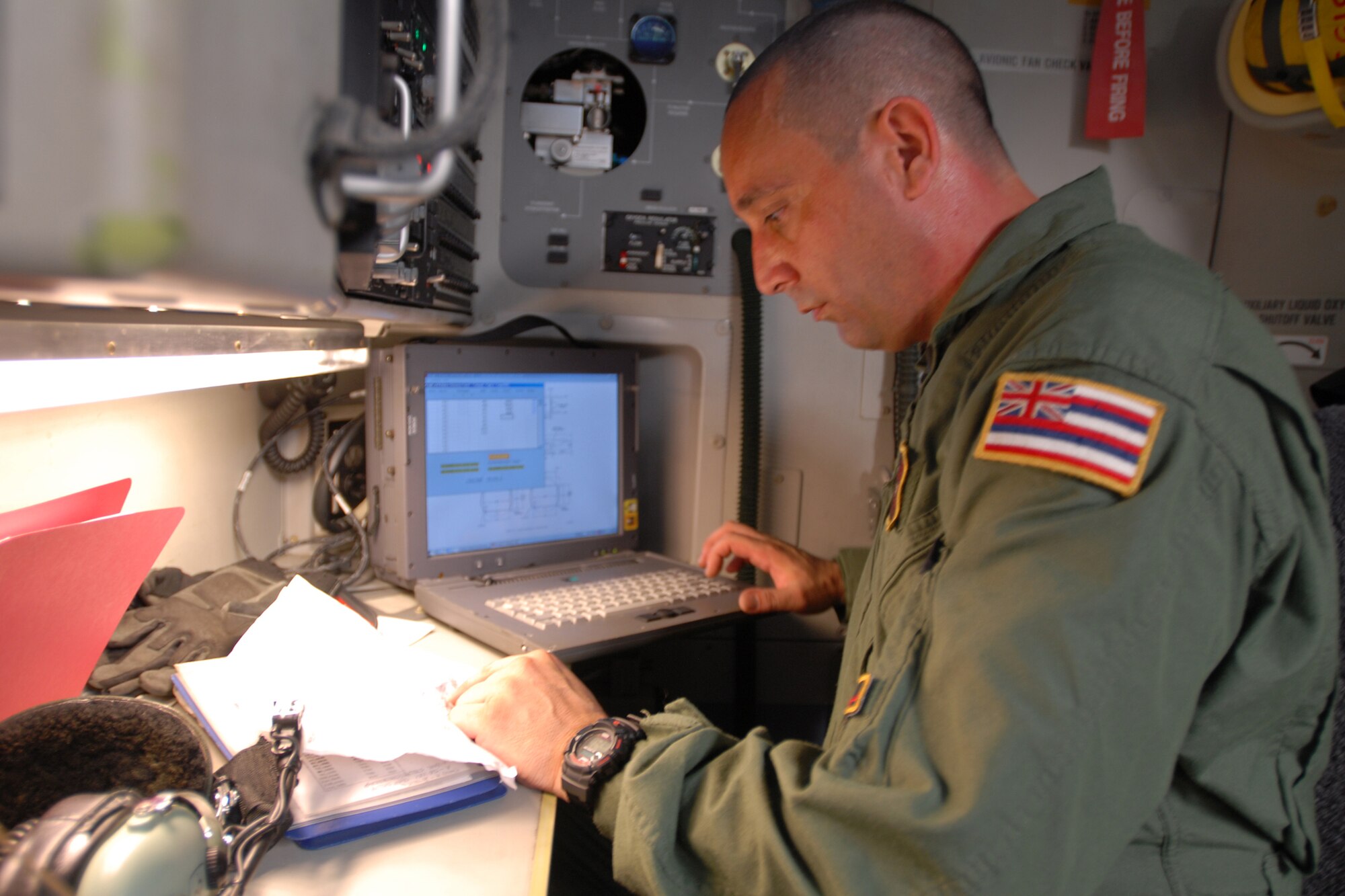 HICKAM AIR FORCE BASE, Hawaii -- Tech. Sgt. Kimo McKee, Hawaii Air National Guard loadmaster, inputs load weight data for humanitarian aid supplies from the Federal Emergency Management Agency after it was loaded by the Hawaii Air National Guard, Hawaii National Guard and Hickam Active Duty Airmen into a C-17 Globemaster III bound for American Samoa to assist in the relief efforts underway Sept 30. The efforts are in the wake of tsunamis triggered by an undersea earthquake Sept. 29 that has left more than 140 people dead in the South Pacific region. More than 90 Airmen and Soldiers deployed from Hawaii for the humanitarian mission. (U.S. Air Force photo/Staff Sgt. Mike Meares)
(U.S. Air Force photo/Staff Sgt. Mike Meares)