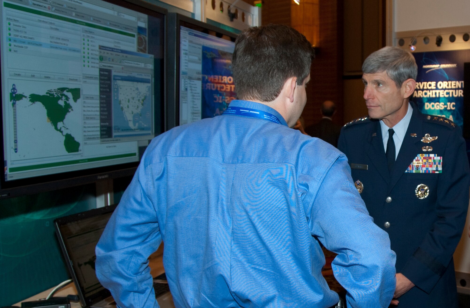 Air Force Chief of Staff Gen. Norton Schwartz reviews one of the many technology displays at the Air Force Command, Control, Intelligence, Surveillance and Reconnaissance Symposium Sept. 30, 2009, at a conference center in Ledyard, Conn. The general also addressed symposium attendees, telling them that technology and doctrine must move in lockstep. (U.S. Air Force photo/Rick Berry)