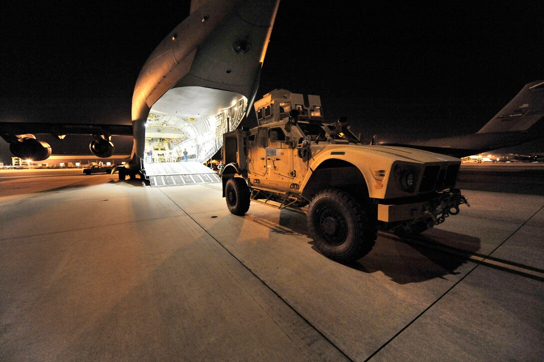 A mine-resistant, ambush-protected armored all-terrain vehicle is loaded onto a C-17 Globemaster III Sept. 30, 2009, at Charleston Air Force Base, S.C. Two M-ATVs were loaded and flown to Afghanistan to support combat missions. The C-17 is based out of McChord AFB, Wash. (U.S. Air Force photo/James M. Bowman)