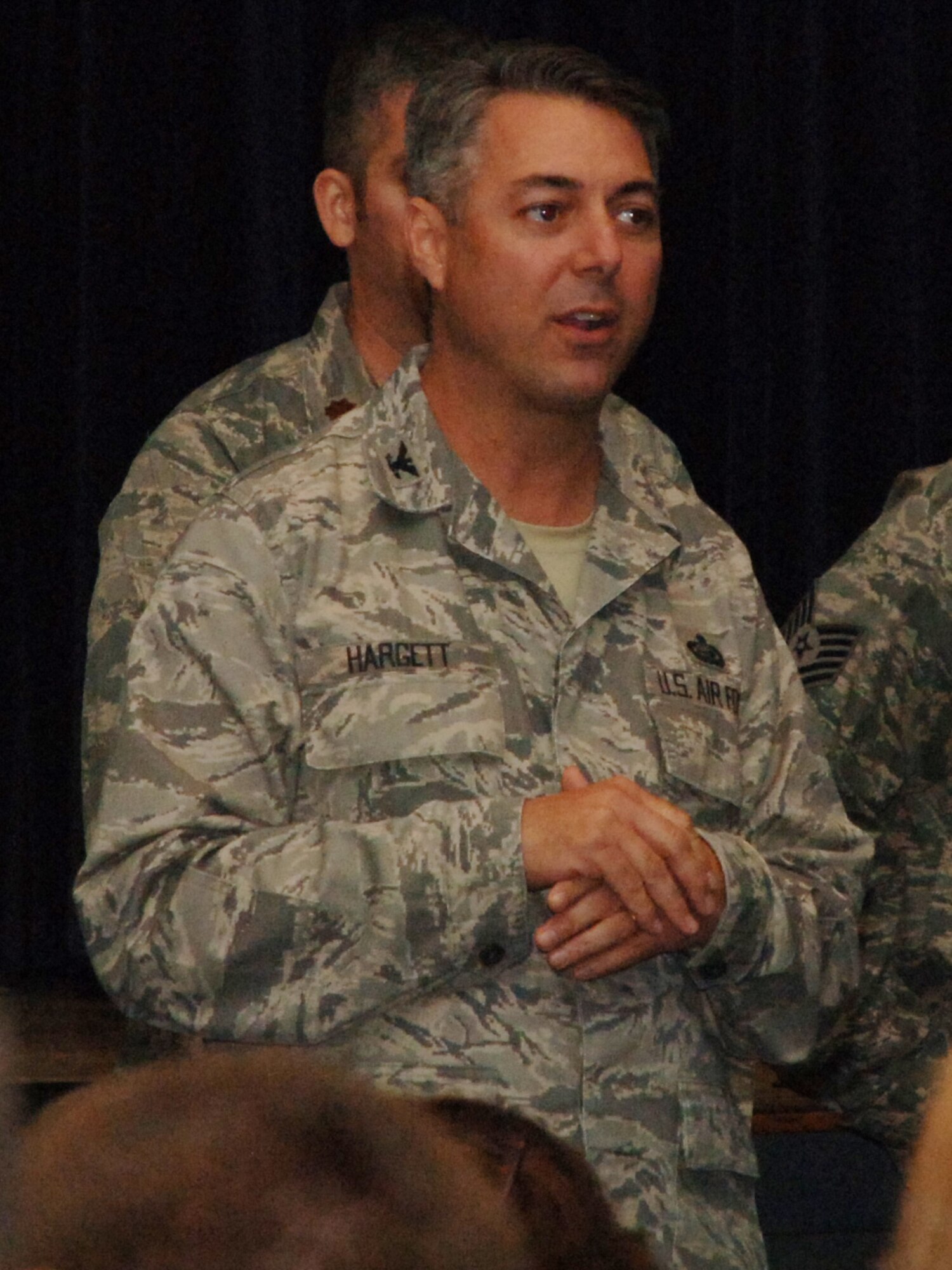 Col. Les Hargett the team lead for the Air Force Personnel Center’s Spread the Word tour, responds to a question during a question and answer session after the briefing at Grand Forks Air Force Base, N.D., Sept. 30.  The topics covered during the Spread the Word tour ranged from the Air Expeditionary Force and tempo banding to upcoming uniform changes and civilian hiring procedures. (U.S. Air Force photo by Airman 1st Class Rachel Martinez)