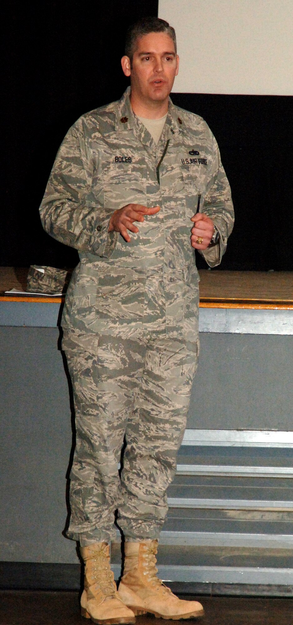 Maj. David Boles, a speaker with the Air Force Personnel Center’s Spread the Word tour, briefs Airmen from Grand Forks Air Force Base, N.D., Sept. 30. The topics covered during the Spread the Word tour ranged from the Air Expeditionary Force and tempo banding to upcoming uniform changes and civilian hiring procedures. (U.S. Air Force photo by Airman 1st Class Rachel Martinez)