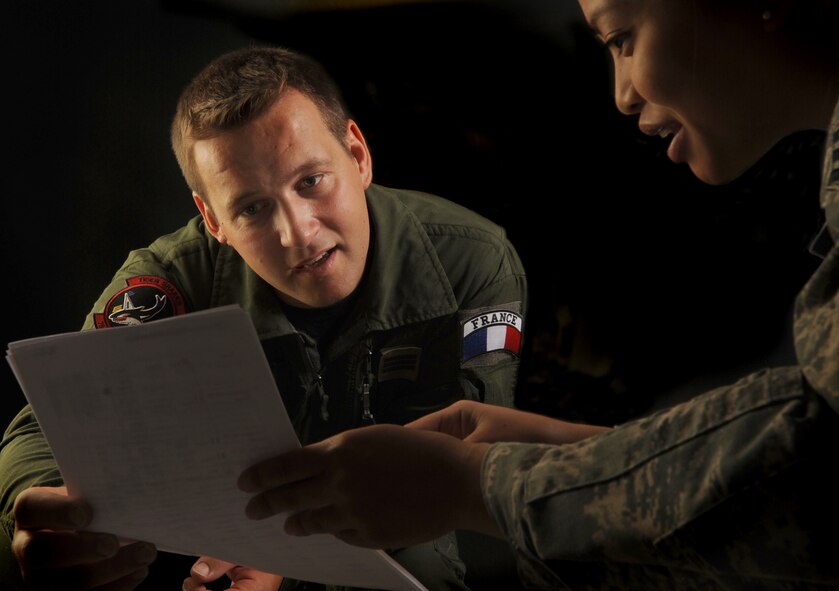 MOODY AIR FORCE BASE, Ga. -- Capt. Yann Malard, a French air force pilot, was recently assigned to the 75th Fighter Squadron here Sept. 25, as part of a three-year officer exchange program. Captain Malard speaks with Senior Airman Frances Locquiao, 23rd Wing Public Affairs assistant section chief of internal information, during an interview Sept. 28. (U.S. Air Force photo by Staff Sgt. Elizabeth Rissmiller)