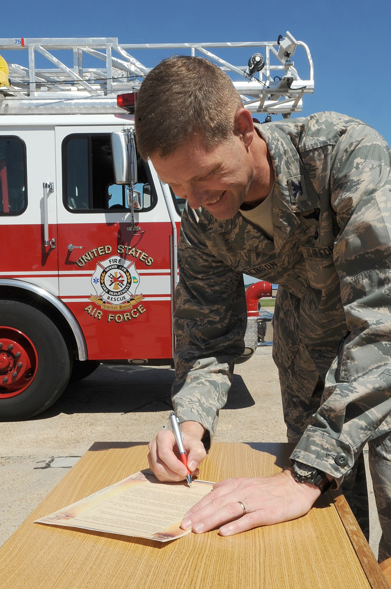 MOODY AIR FORCE BASE, Ga. -- Col. Gary Henderson, 23rd Wing commander, signs the Fire Prevention Week Proclamation here Oct. 1. Fire Prevention Week is observed Oct. 5-9, it’s goal is to increase awareness of the base community in fire prevention and safety. (U.S. Air Force photo by Staff Sgt. Elizabeth Rissmiller)
