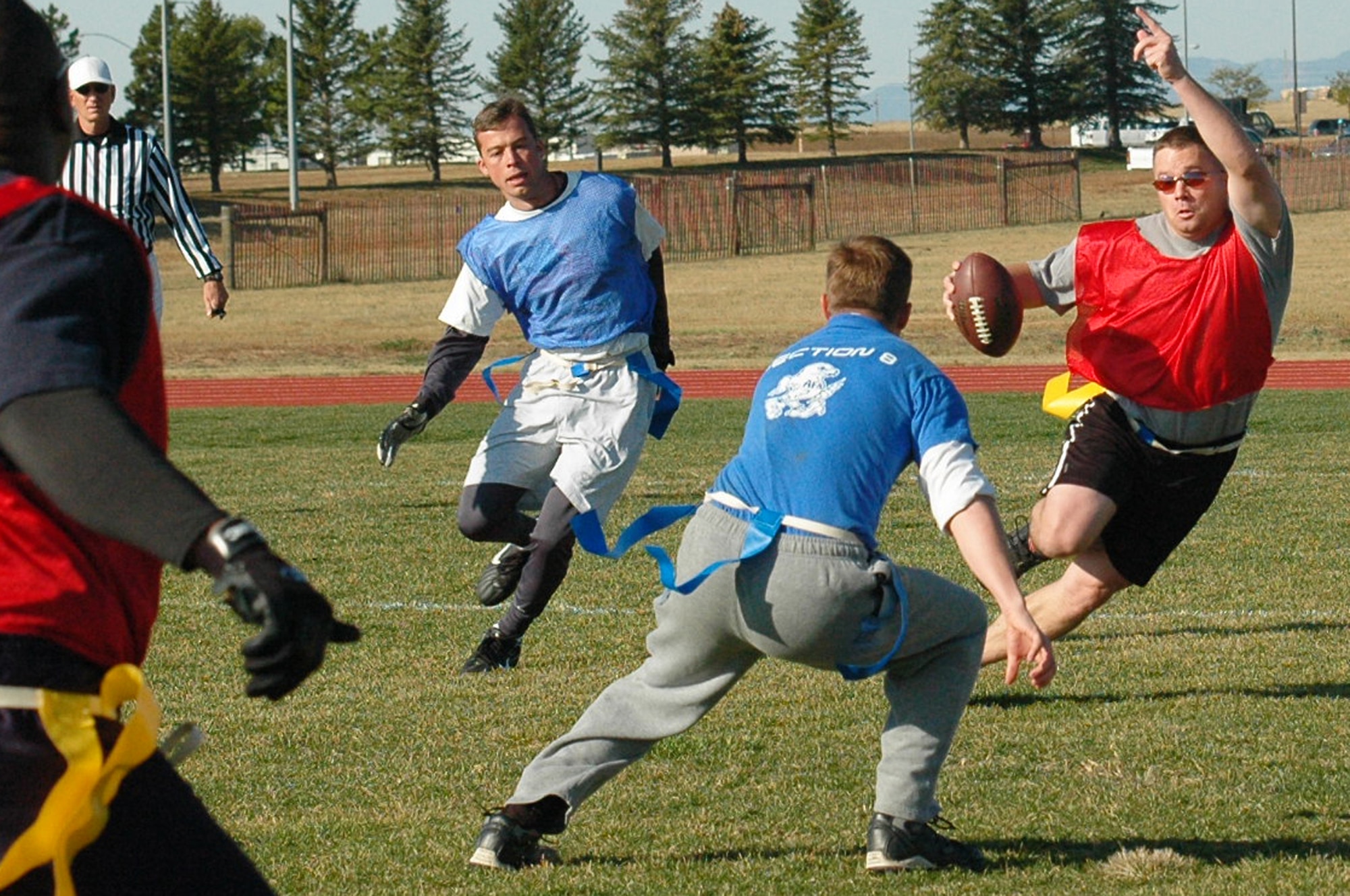 SCHRIEVER AIR FORCE BASE, Colo. -- Quarterback Tech. Sgt Craig Thompson, 11th Space Warning Squadron rushes for first down. (U.S. Air Force photo/Scott Prater)