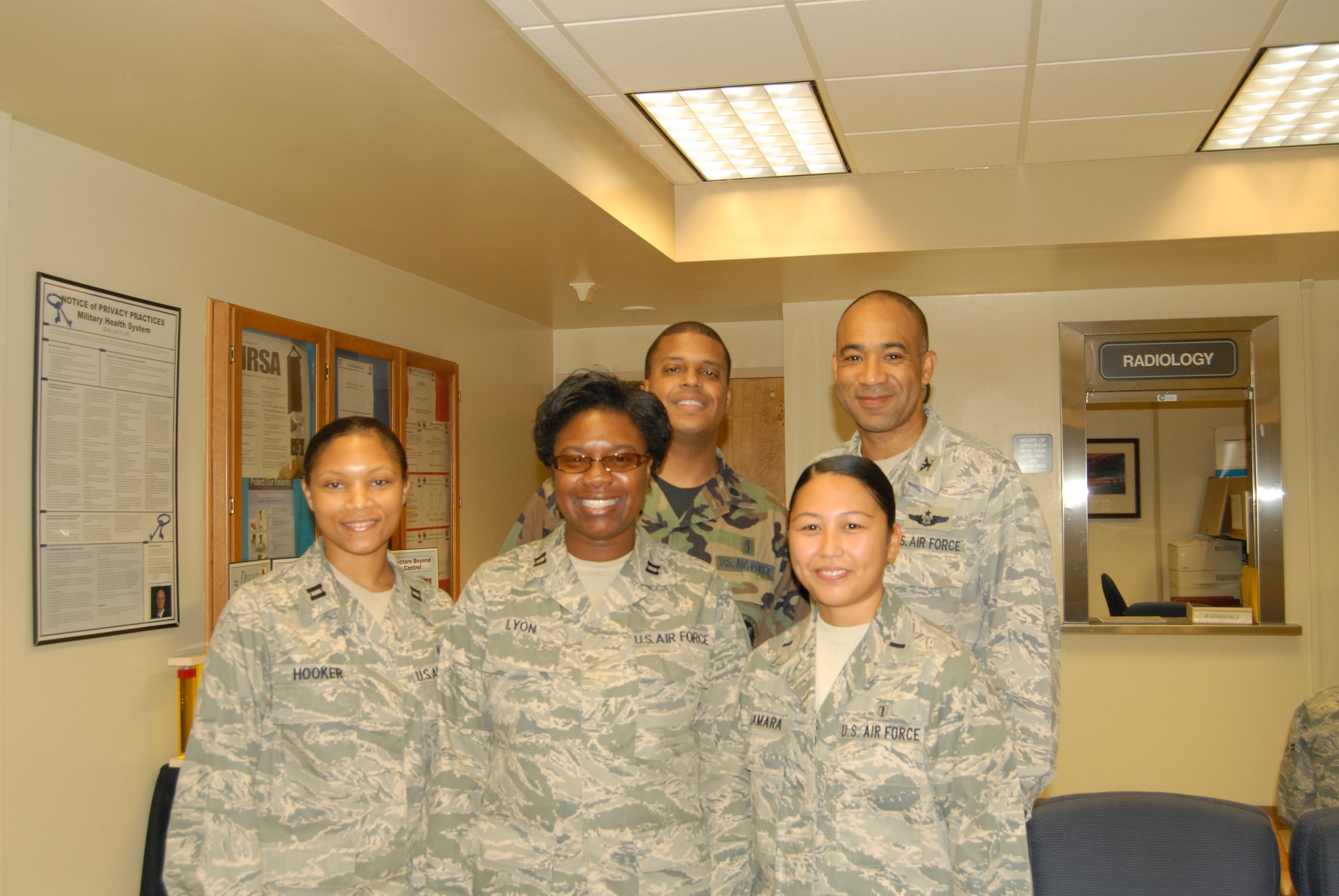 Col. James Johnson, 43rd Airlift Wing Commander, presents a Commander’s Coin Sept. 29 to Lt. Col. Trent Tate, Capt. Deidra Lyon, Capt. Laquanis Hooker and 1st Lt. Joya Gamara, all from the 43rd Medical Group. (U.S. Air Force Photo by 2nd Lt. Cammie Quinn)