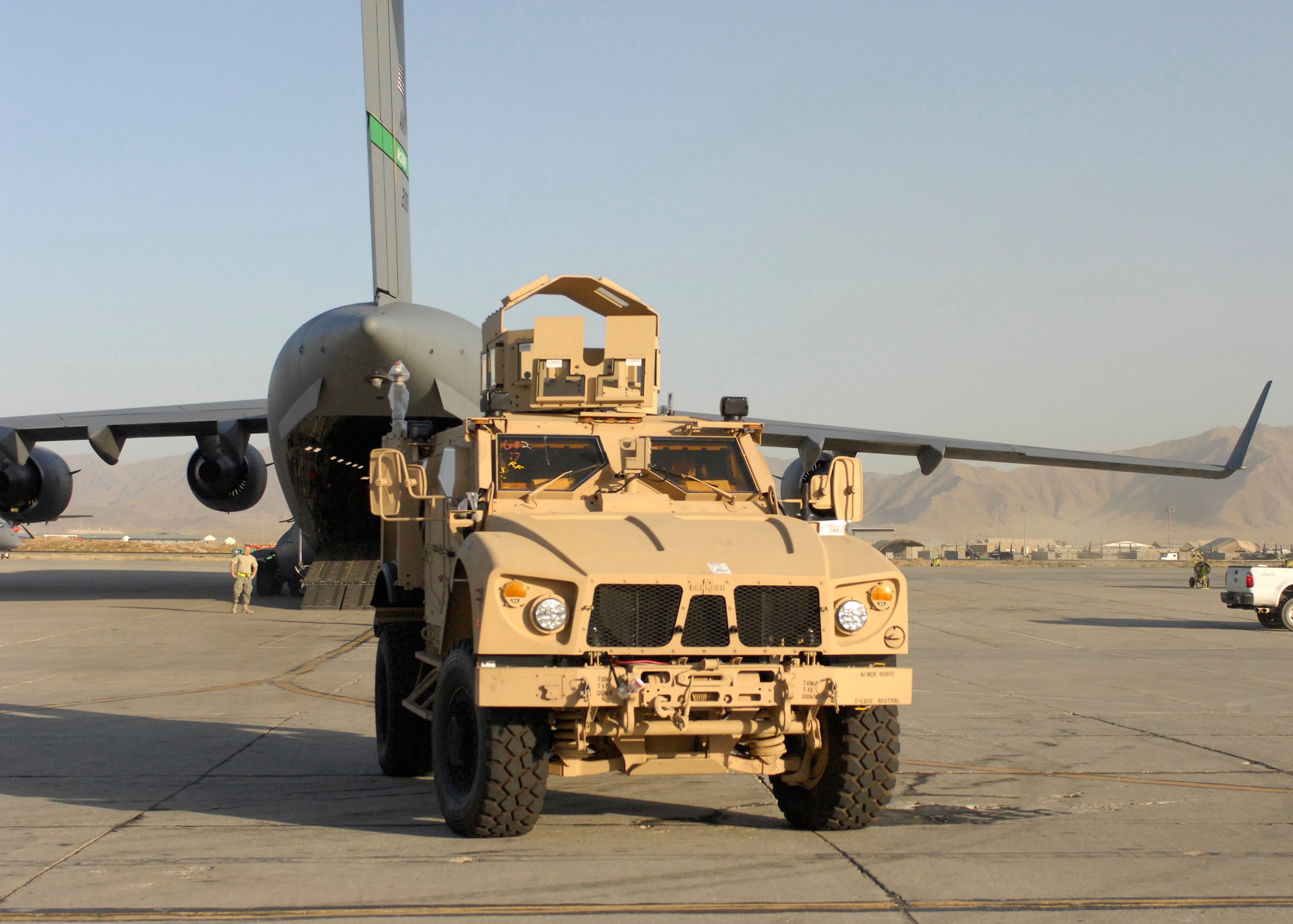 A mine-resistant, ambush-protected all-terrain vehicle sits on the tarmac at Bagram Airfield, Afghanistan, Oct. 1, 2009, after being offloaded from a C-17 Globemaster III less than a day after leaving Charleston Air Force Base, S.C. The M-ATV's are the first of their kind in Afghanistan and support small-unit combat operations in highly restricted rural, mountainous and urban environments that include mounted patrols, reconnaissance, security, convoy protection, communications, command and control, and combat service support. The M-ATV is designed to replace the up-armored Humvee in Afghanistan. The M-ATV will carry up to five personnel. (U.S. Air Force photo/Senior Airman Susan Tracy)