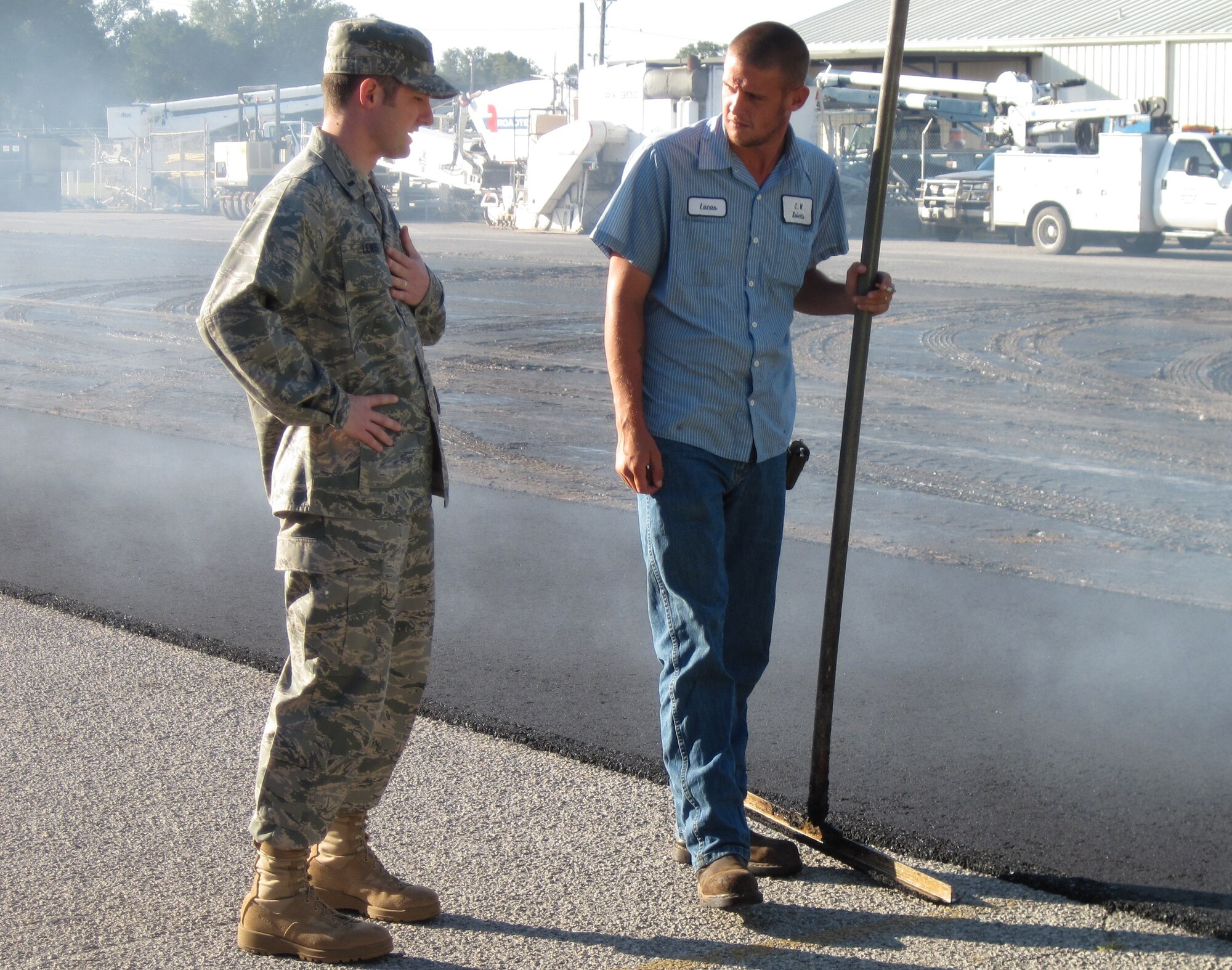 First Lieutenant Rodney Lewis, contracting officer for Eglin's infrastructure flight, visits contractors at a work site on base Sept. 29. The 96th Contracting Squadron works with civil engineers and base finance to procure millions of dollars for large projects like construction of facilities for the Joint Strike Fighter, pavement of the runway and quality-of-life efforts like carpet installation in the dorms. (U.S. Air Force photo/Chrissy Cuttita)