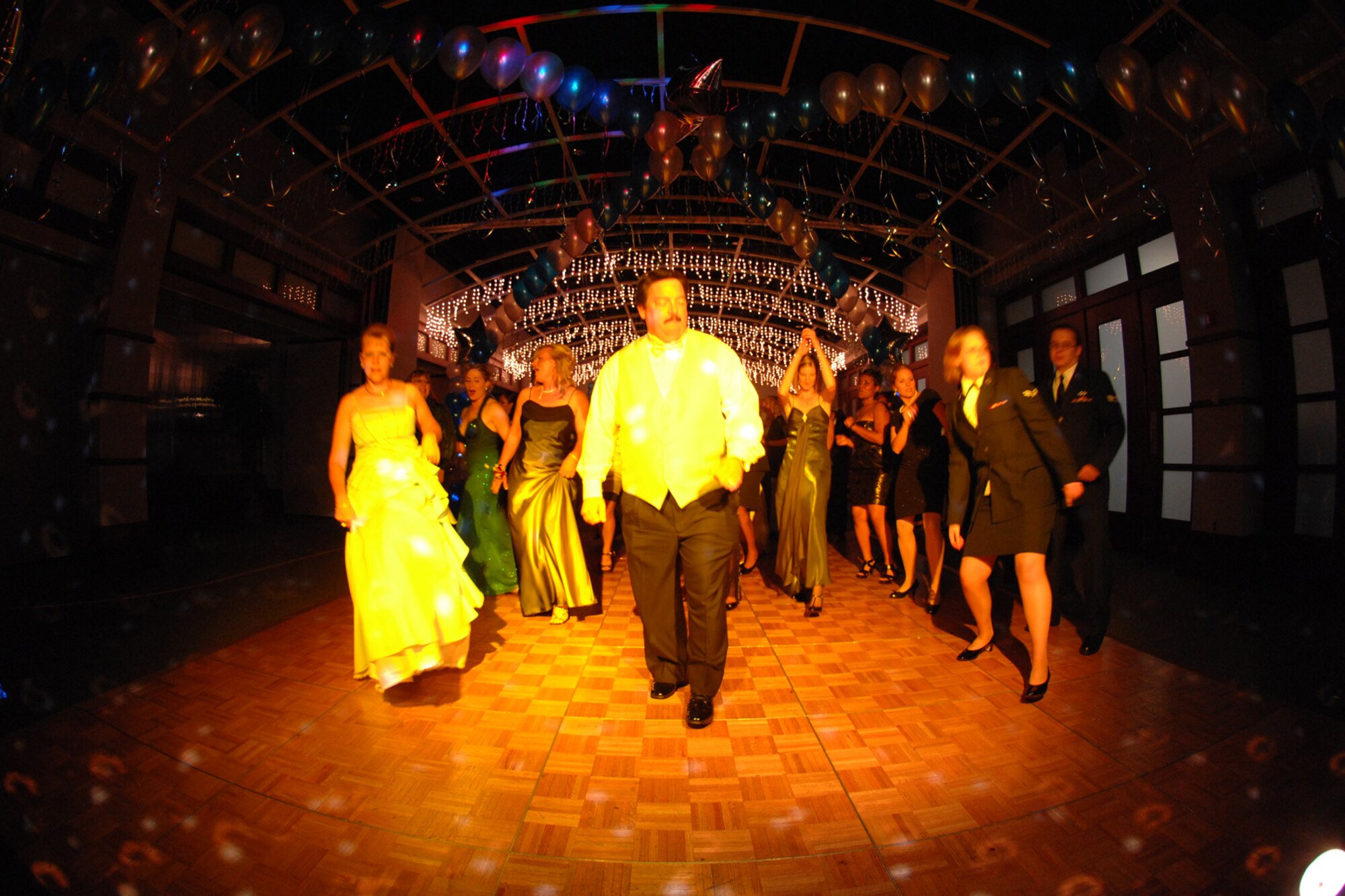 Guests attending the McConnell Air Force Base, Kan., Air Force Ball dance to music after a formal dinner and ceremony, Sept. 25, 2009. In addition to commemorating the Air Force’s creation on Sept. 18, 1947, the ball’s theme ‘Year of the KC-135’ celebrated the 22nd Air Refueling wing’s mission. (U.S. Air Force photo/Staff Sgt. Jamie Train)